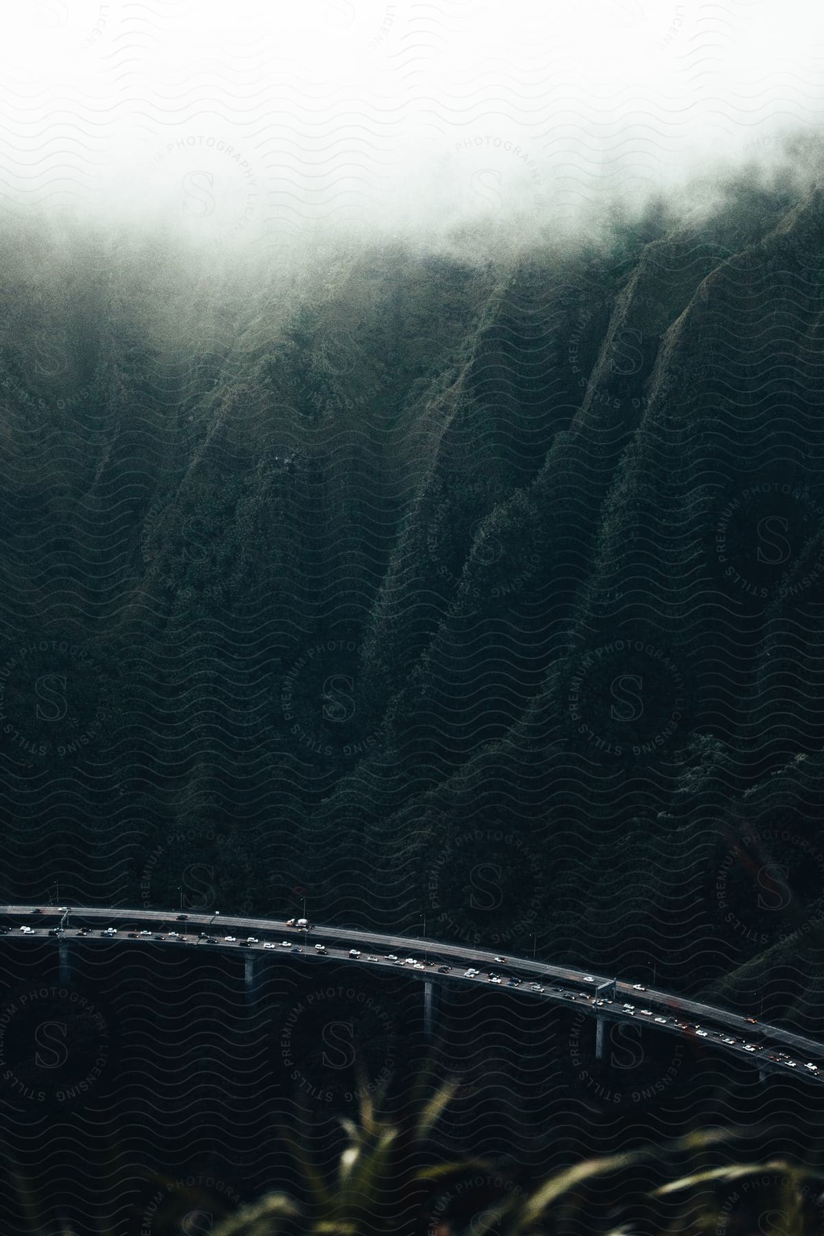 A serene mountain landscape with water and a bridge