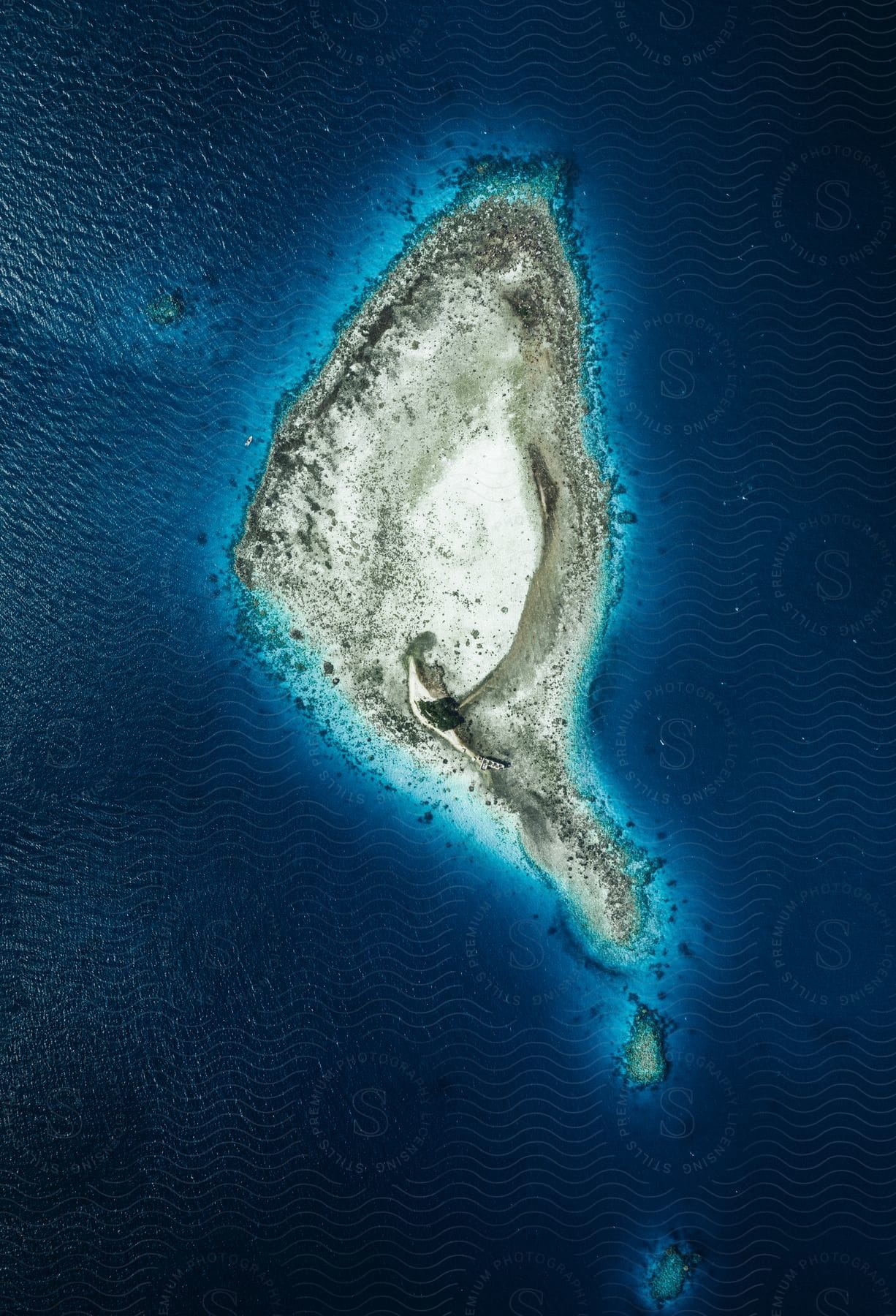 Aerial shot of a small island in the middle of the ocean
