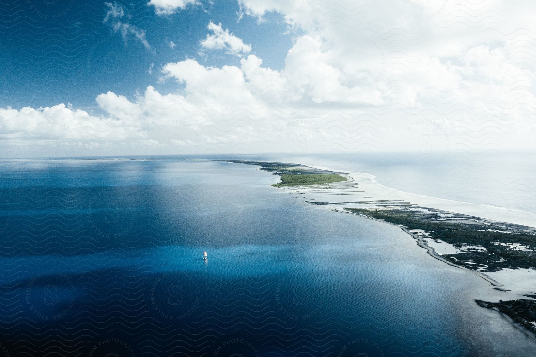 A boat in the ocean waters during midday