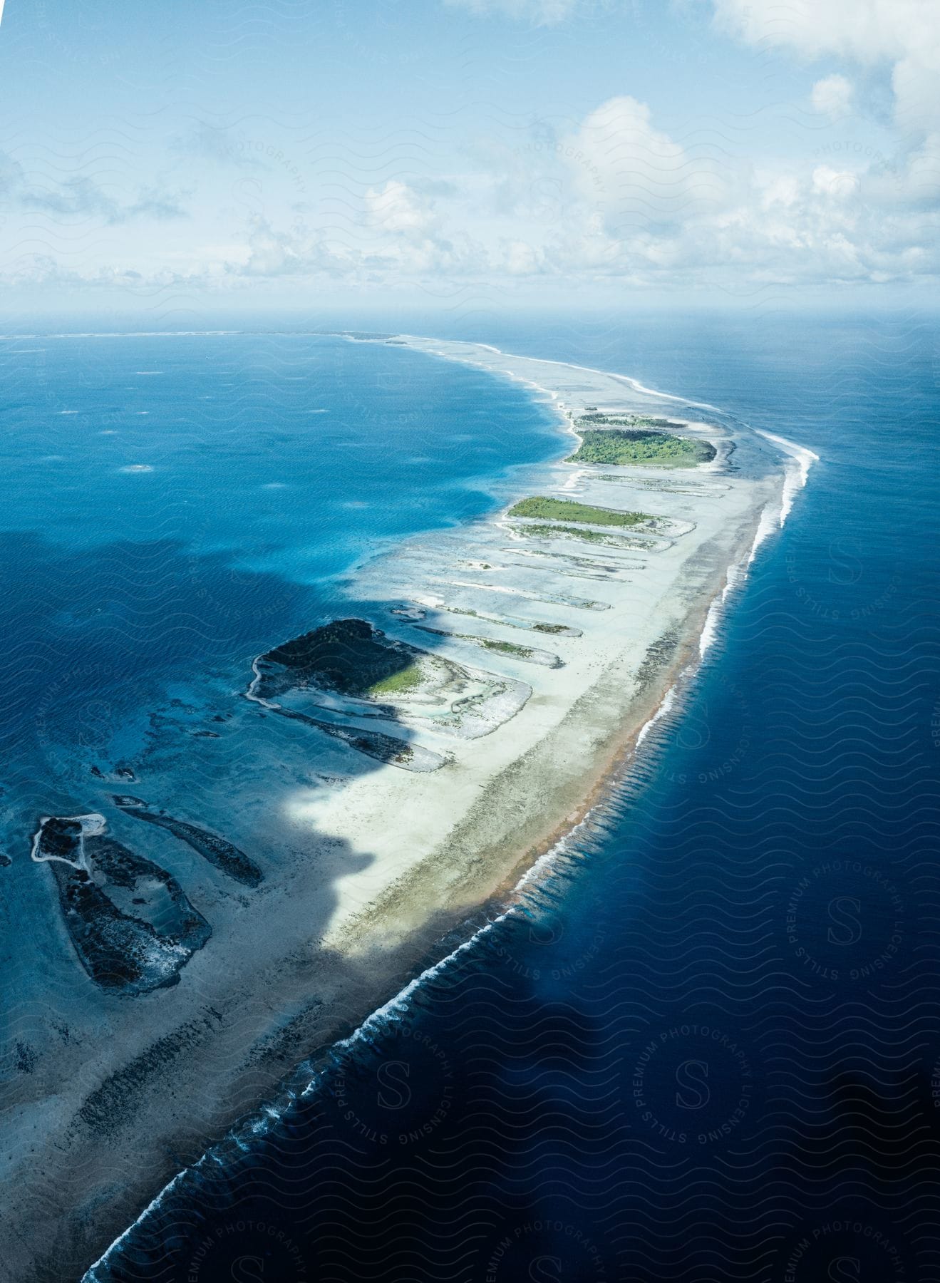 Aerial view of a thin island surrounded by water