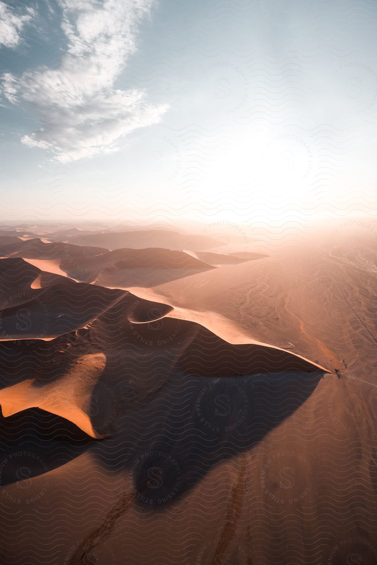 Aerial shot of desert landscape with dunes