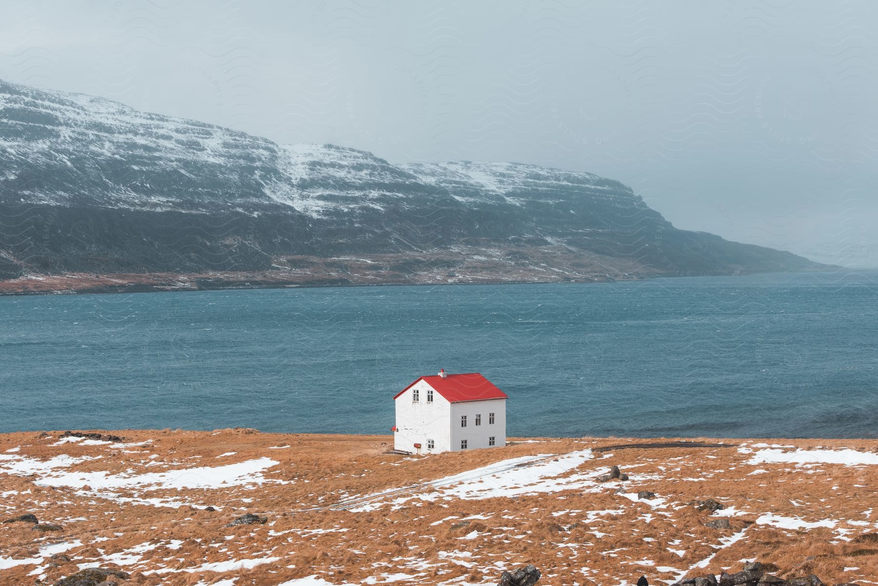 A lone house on the bank of a river