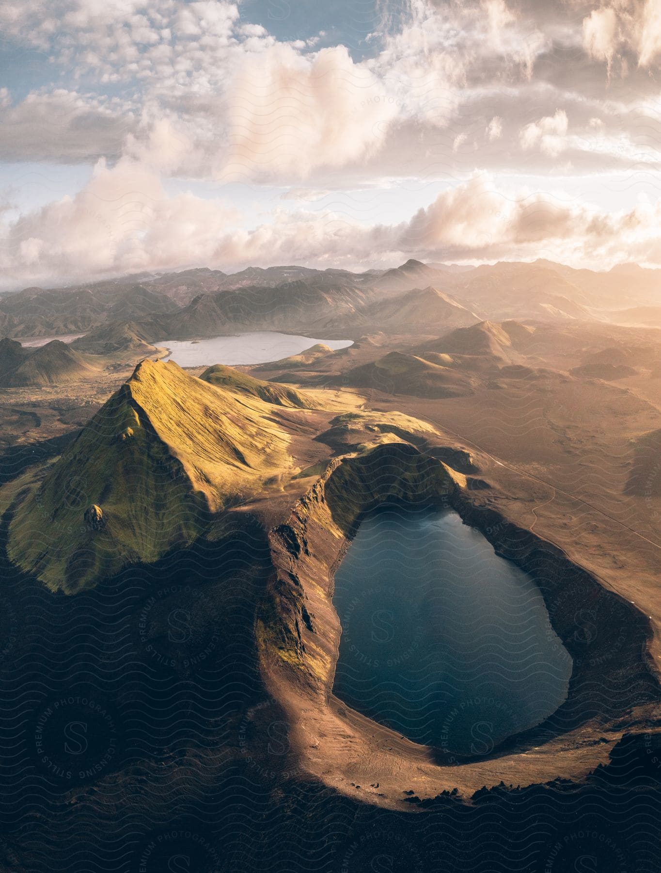 Aerial view of a mountainous landscape with a body of water