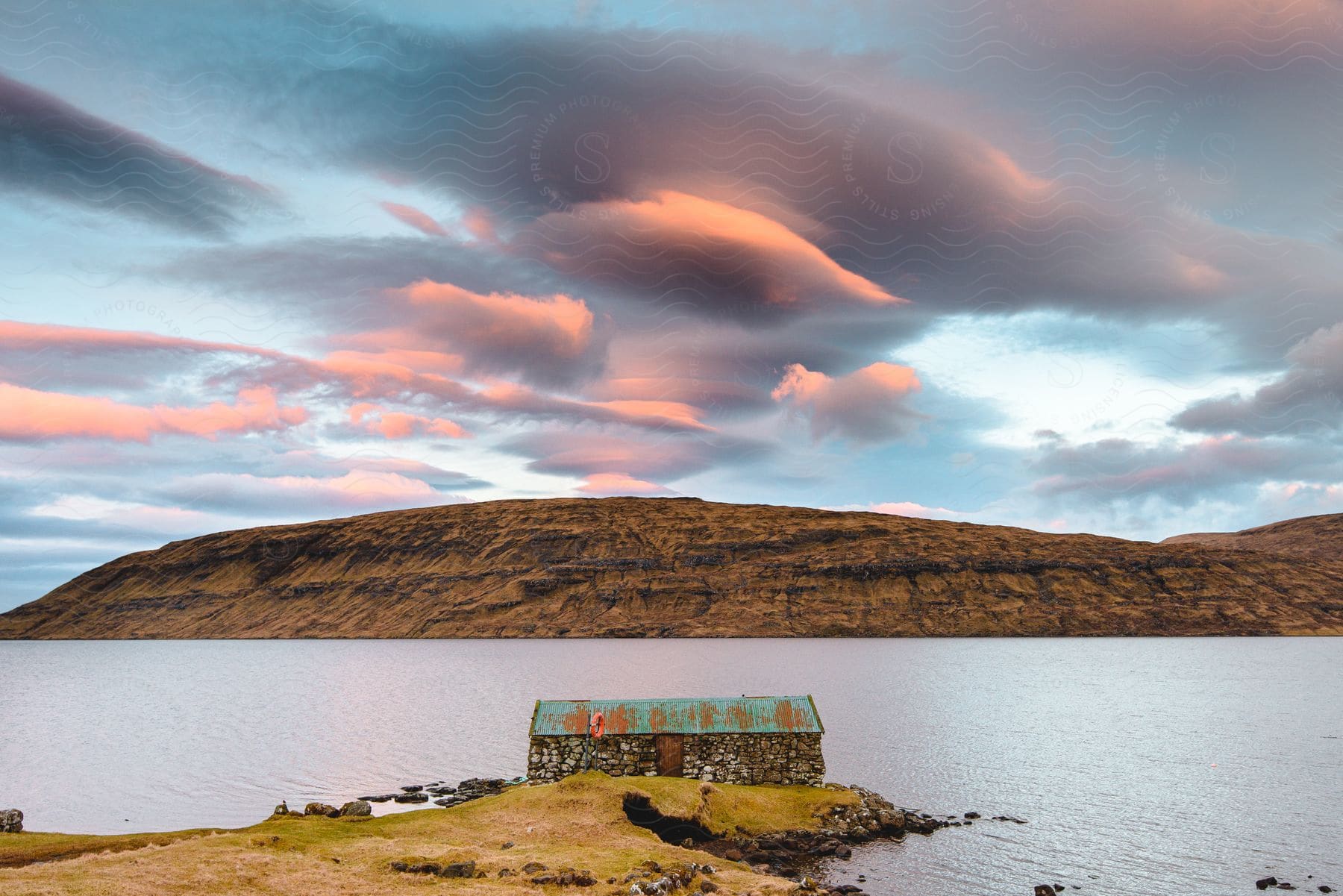 An old house on the bank of a lake