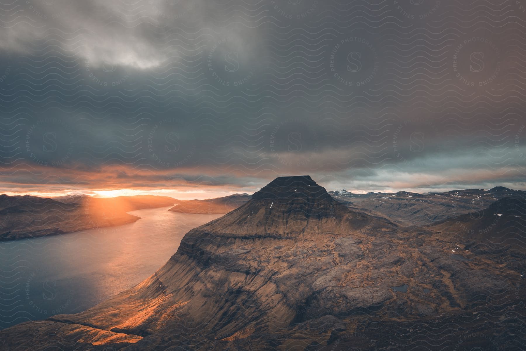 Skælingsfjall mountain in the faroe islands with a dotted island and sornfelli in the background