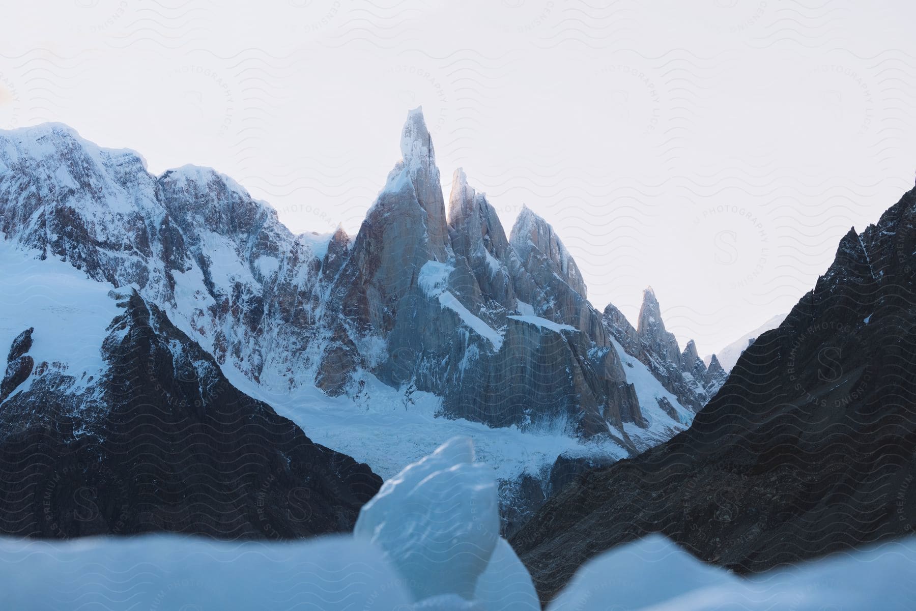 Gray snowcovered mountains against a clear sky in patagonia