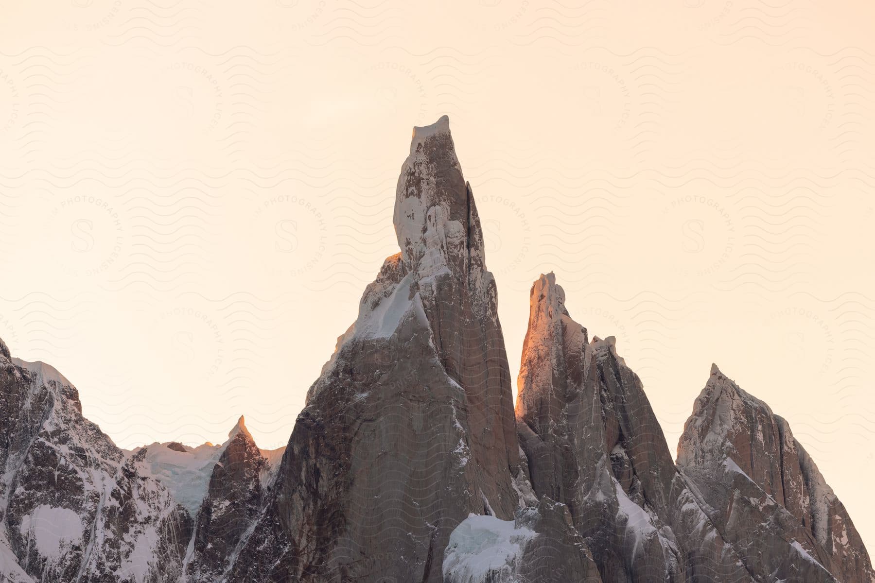 Pointy mountains with a bit of snow up close