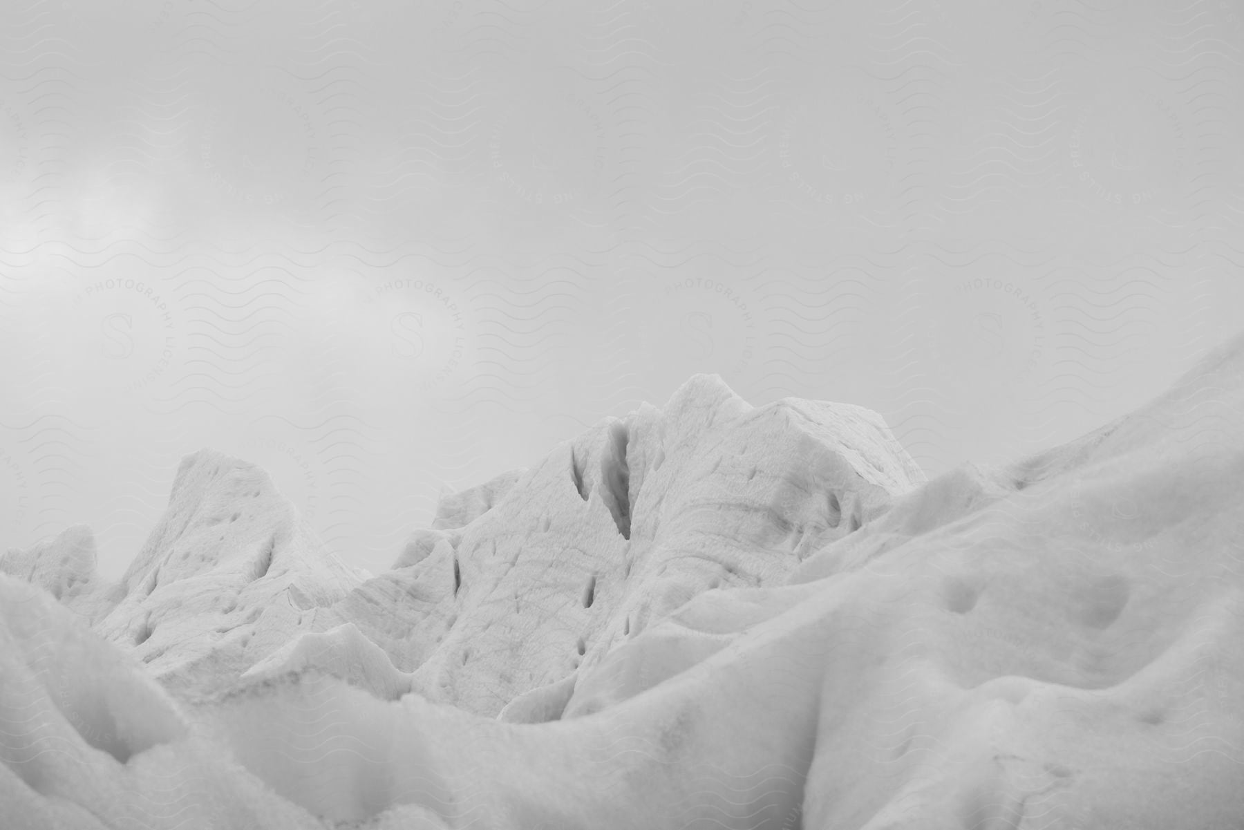 Snow covered land in patagonia with a clear sky and icy slopes