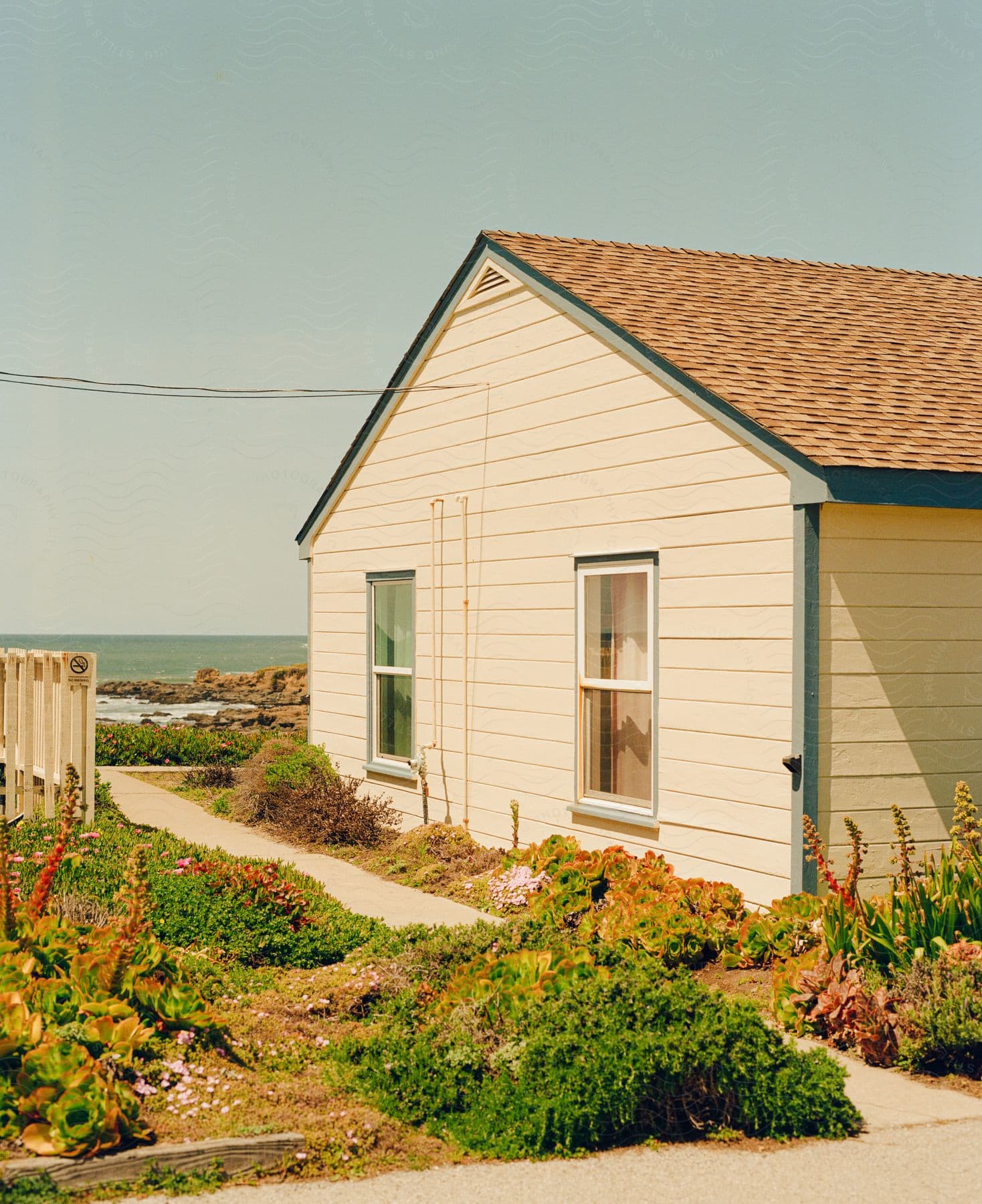 A coastal house with a small garden
