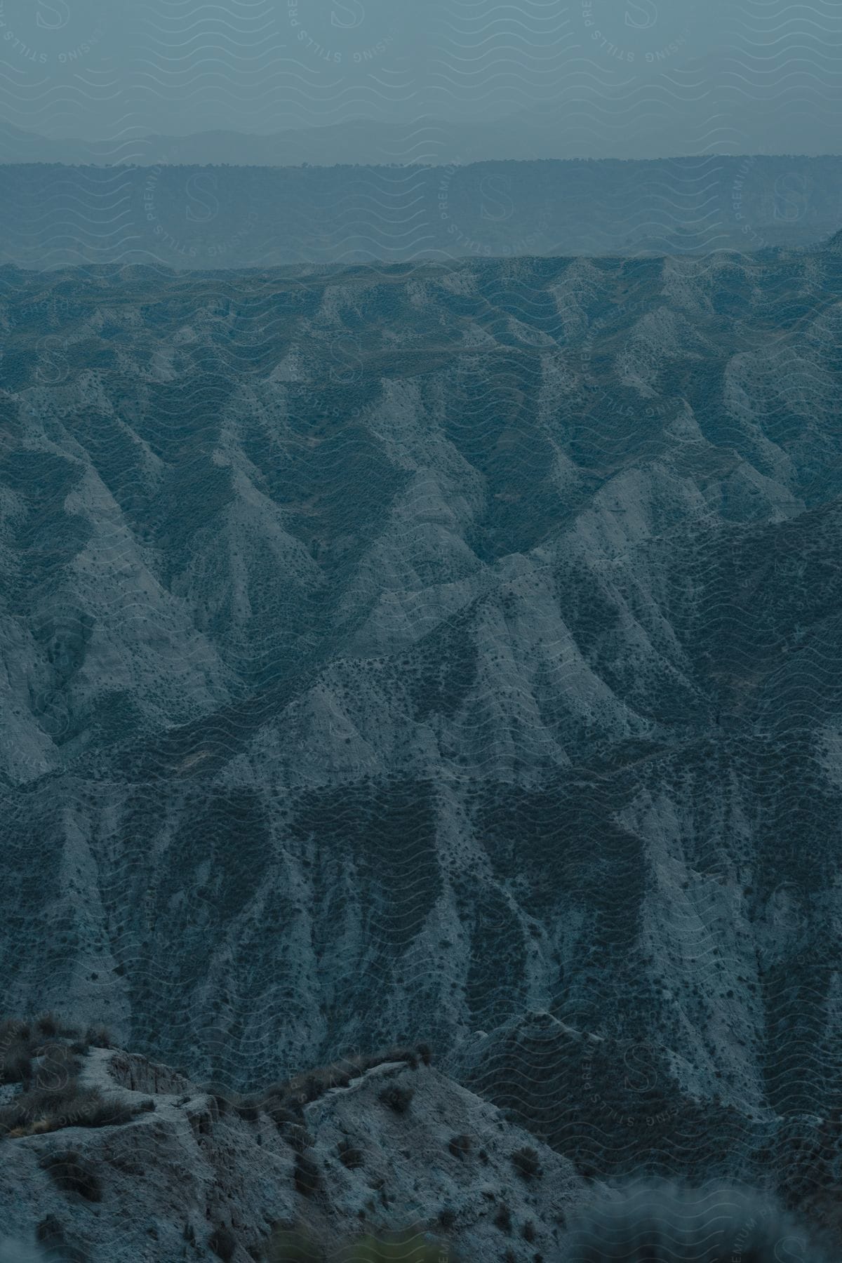 A barren mountain range in spain with a freezing ice cap and steep slopes