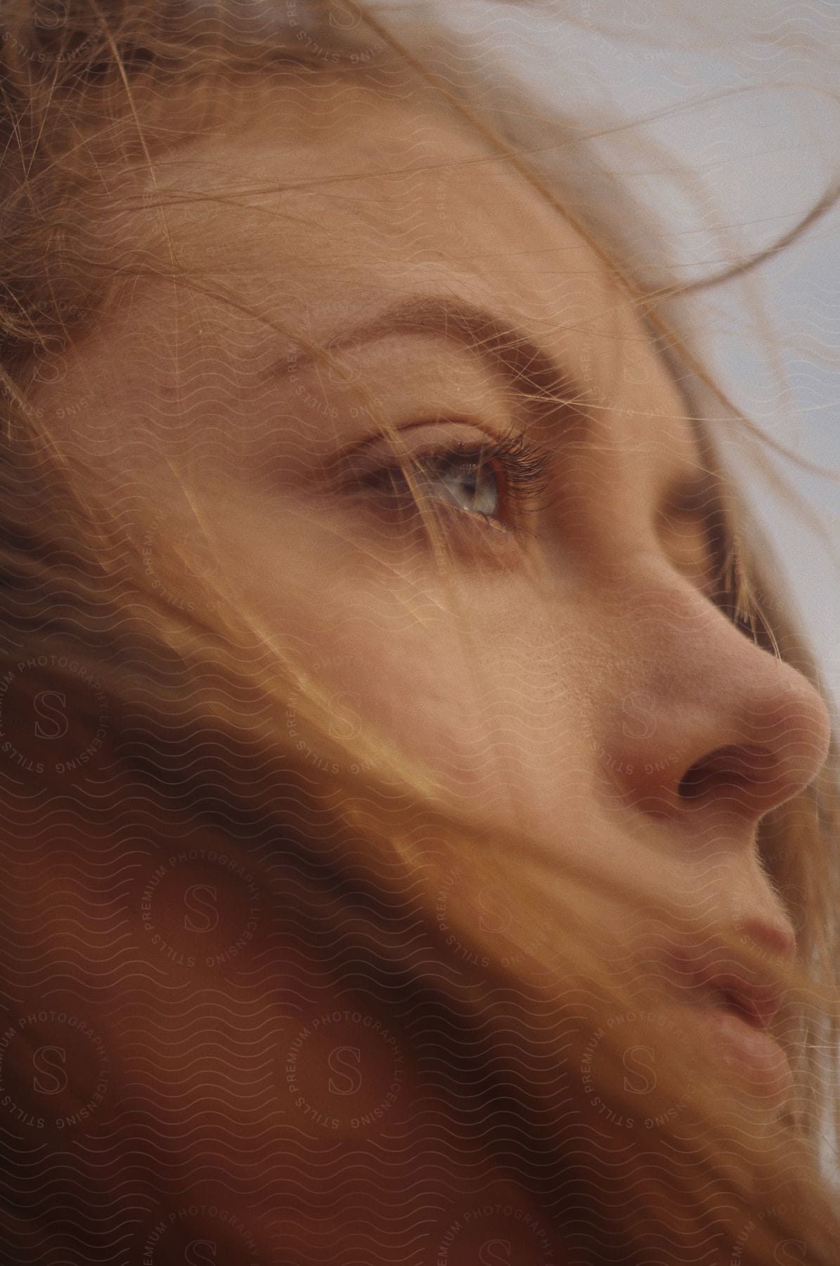 A determined woman with a focused expression looking to the right