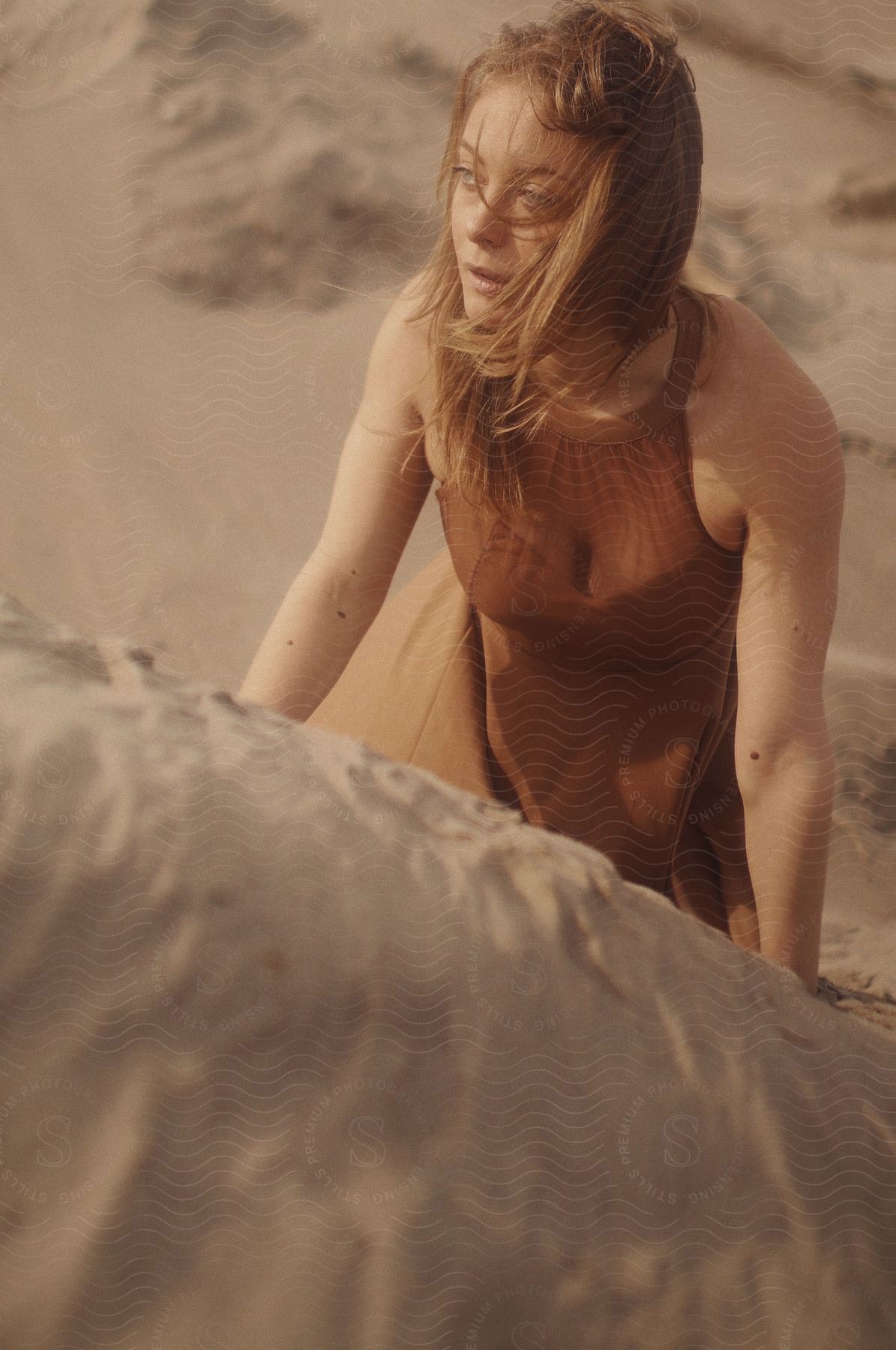 A woman on a beach in swimwear