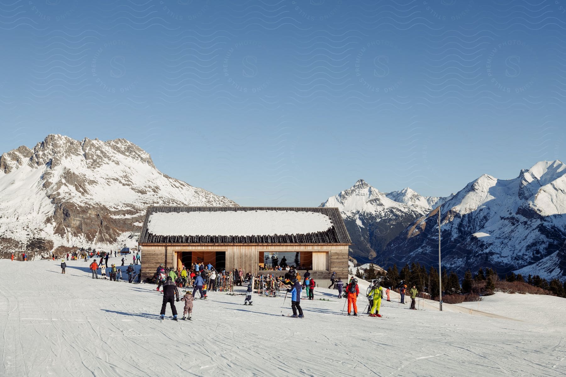 A group of people skiing near the mountains