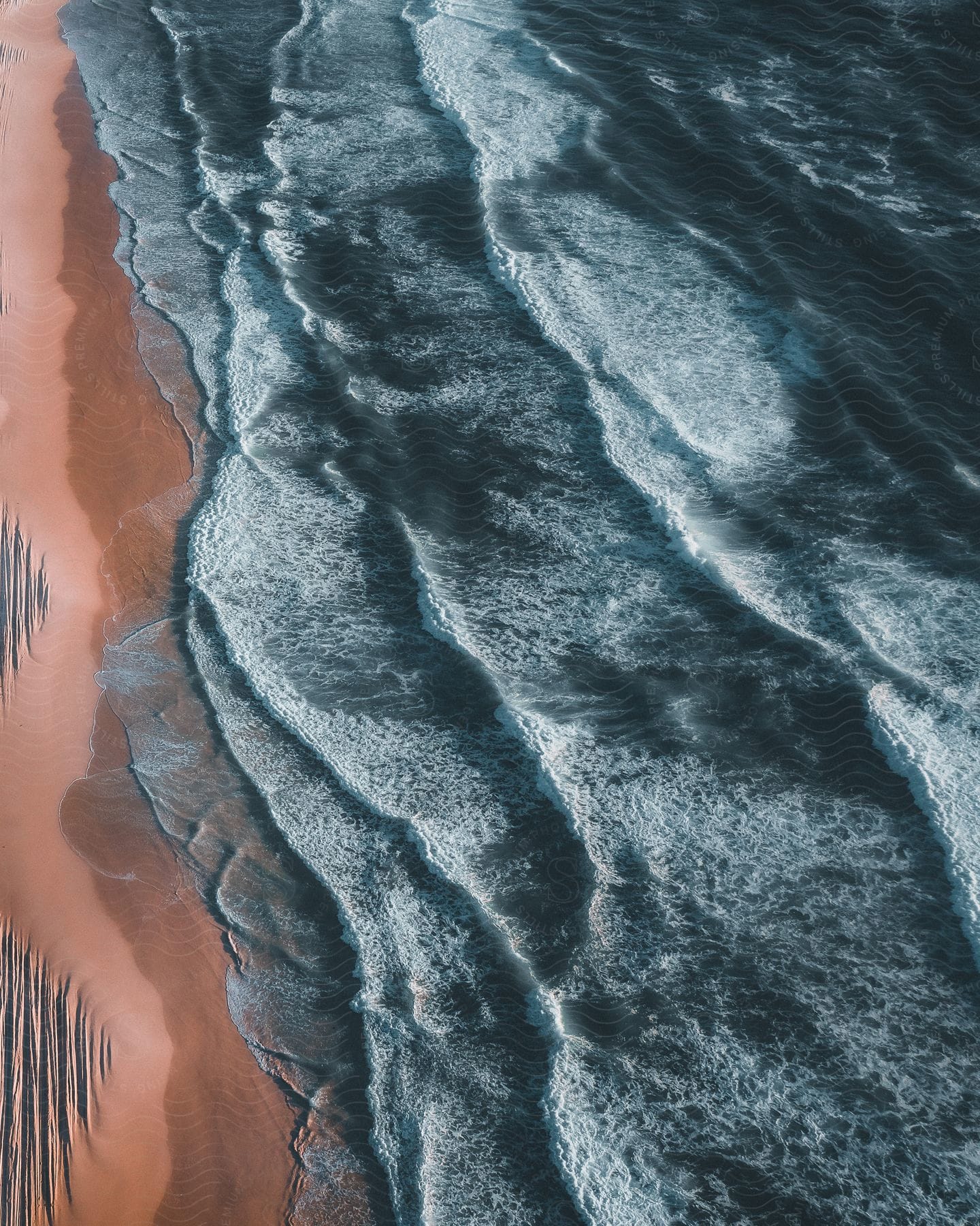 Ocean Waves Moving Towards The Coast From An Aerial Perspective