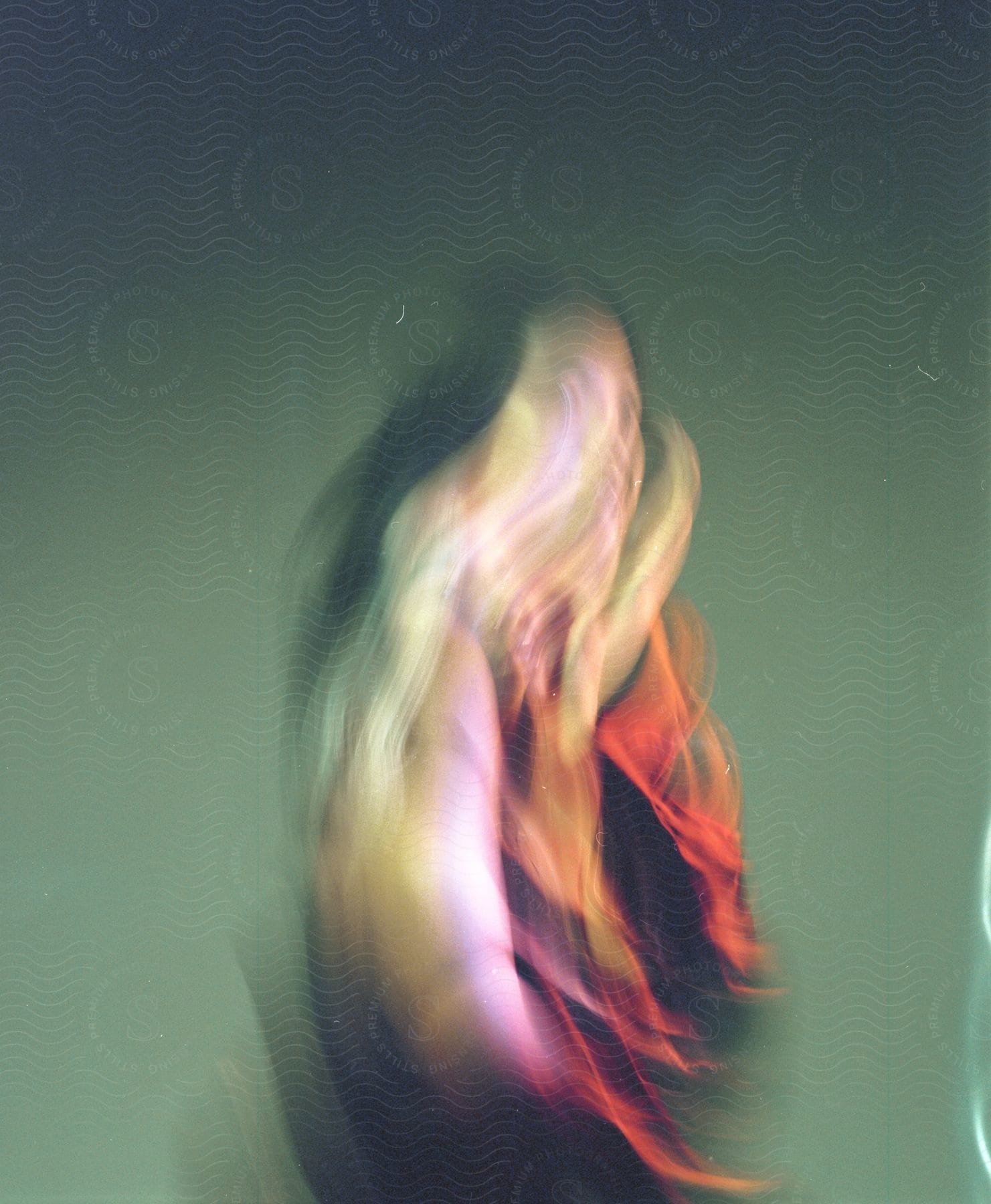 Distorted person captured in abstract multiple exposure indoors