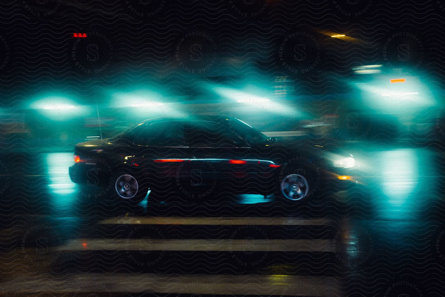 A car driving on a road at night