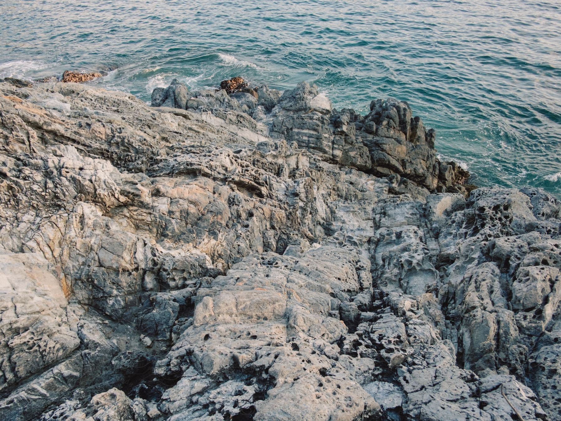 Rocky coastline with a piece of sea