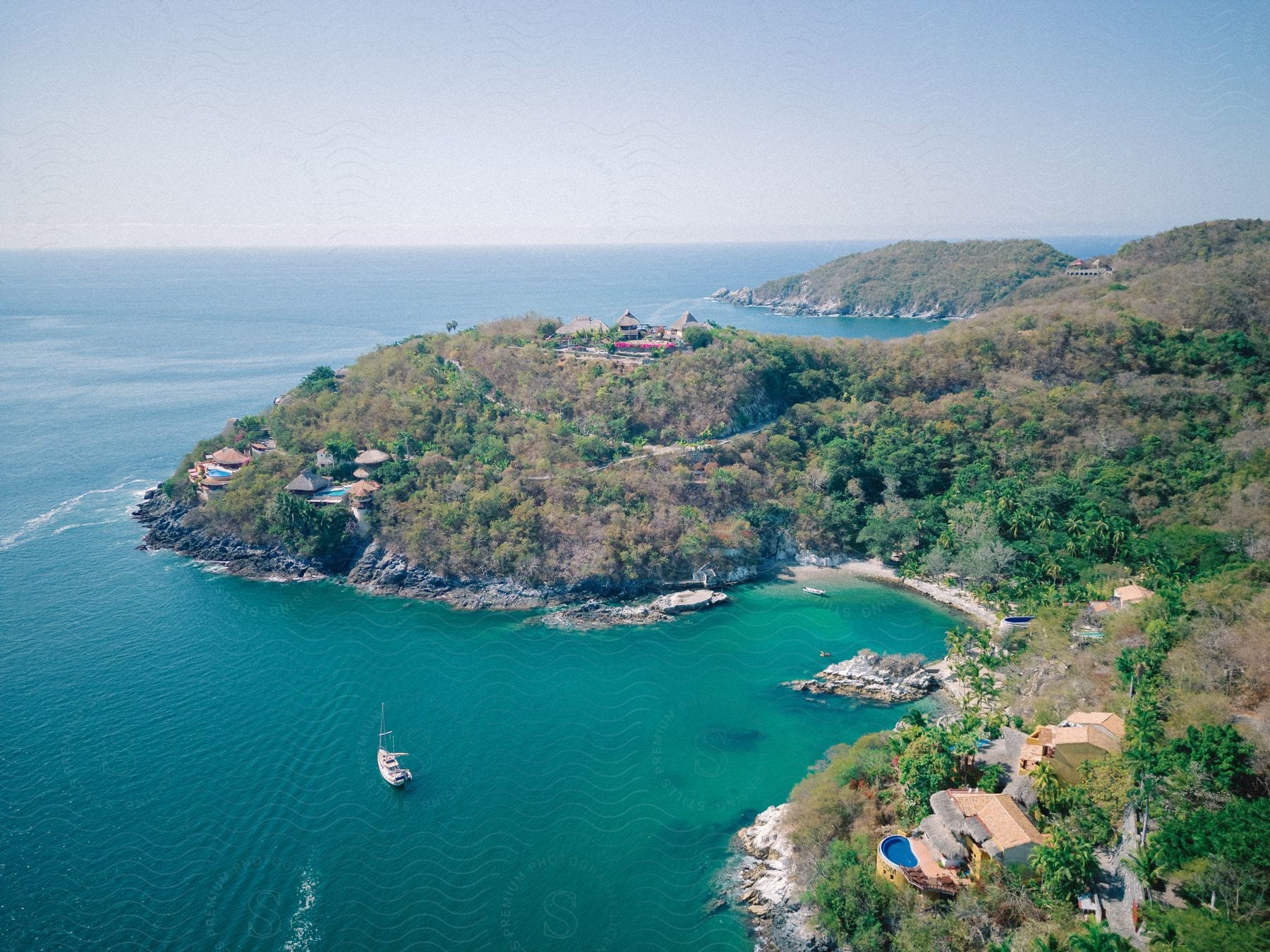 Coastal beach with vegetation and houses