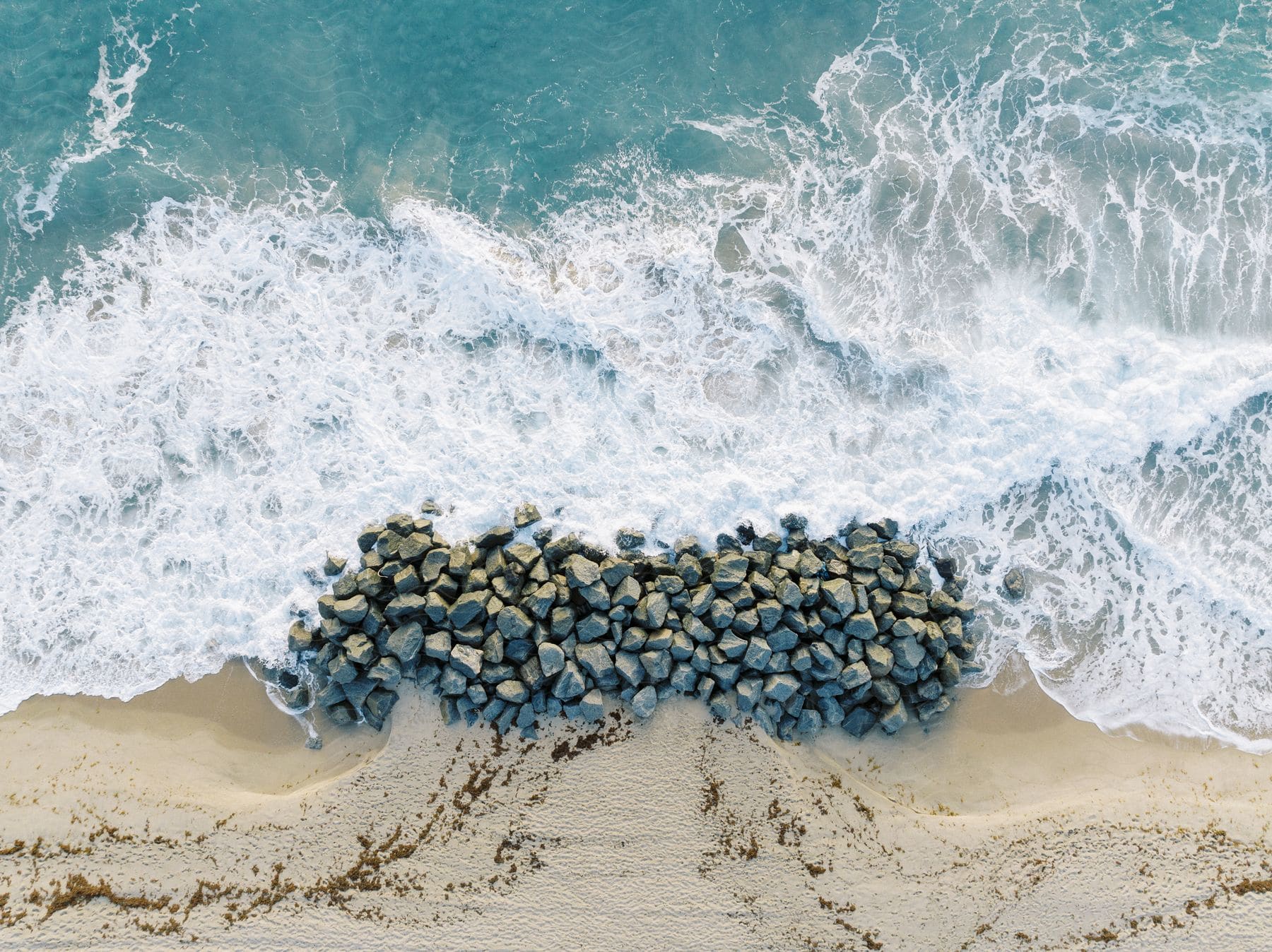 Aerial beach with rocks on the coast