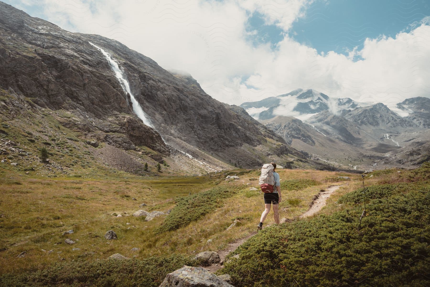 A person hiking in the mountains of dolomites italy