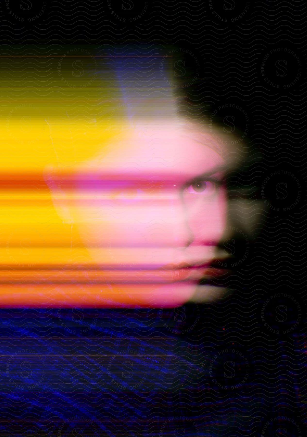 A closeup motion blurred portrait of a woman with altered colors