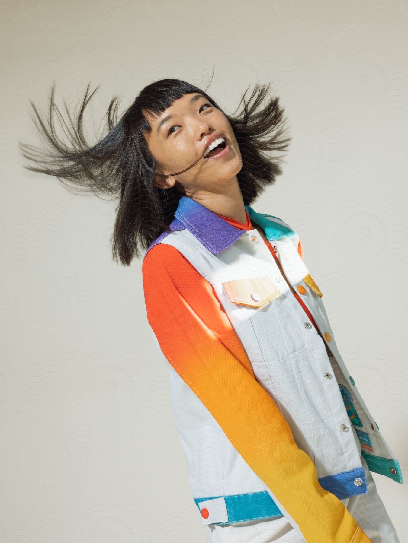 Woman with hair in motion smiling for a photo