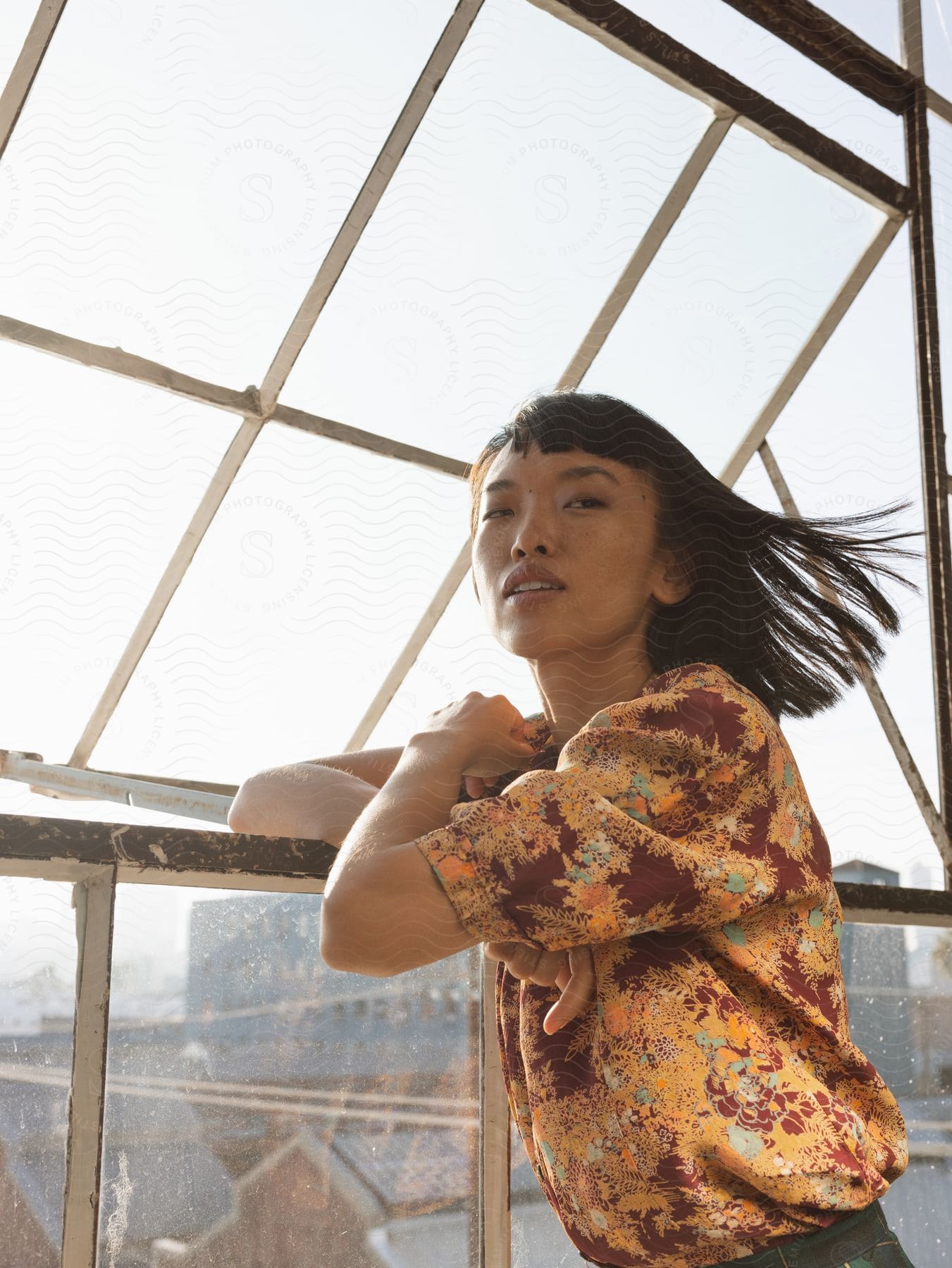 Woman standing near a window