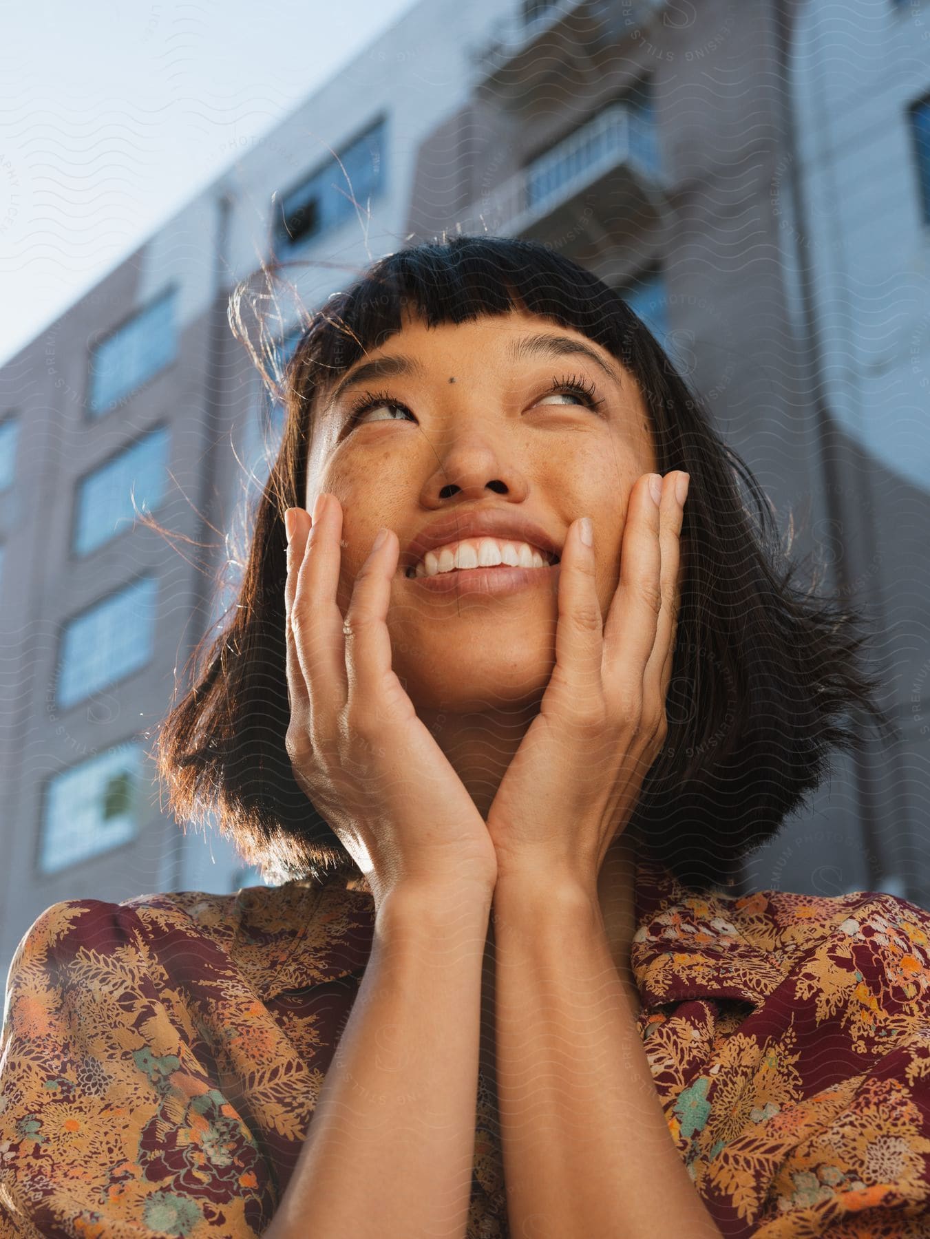 A woman stands in a downtown city