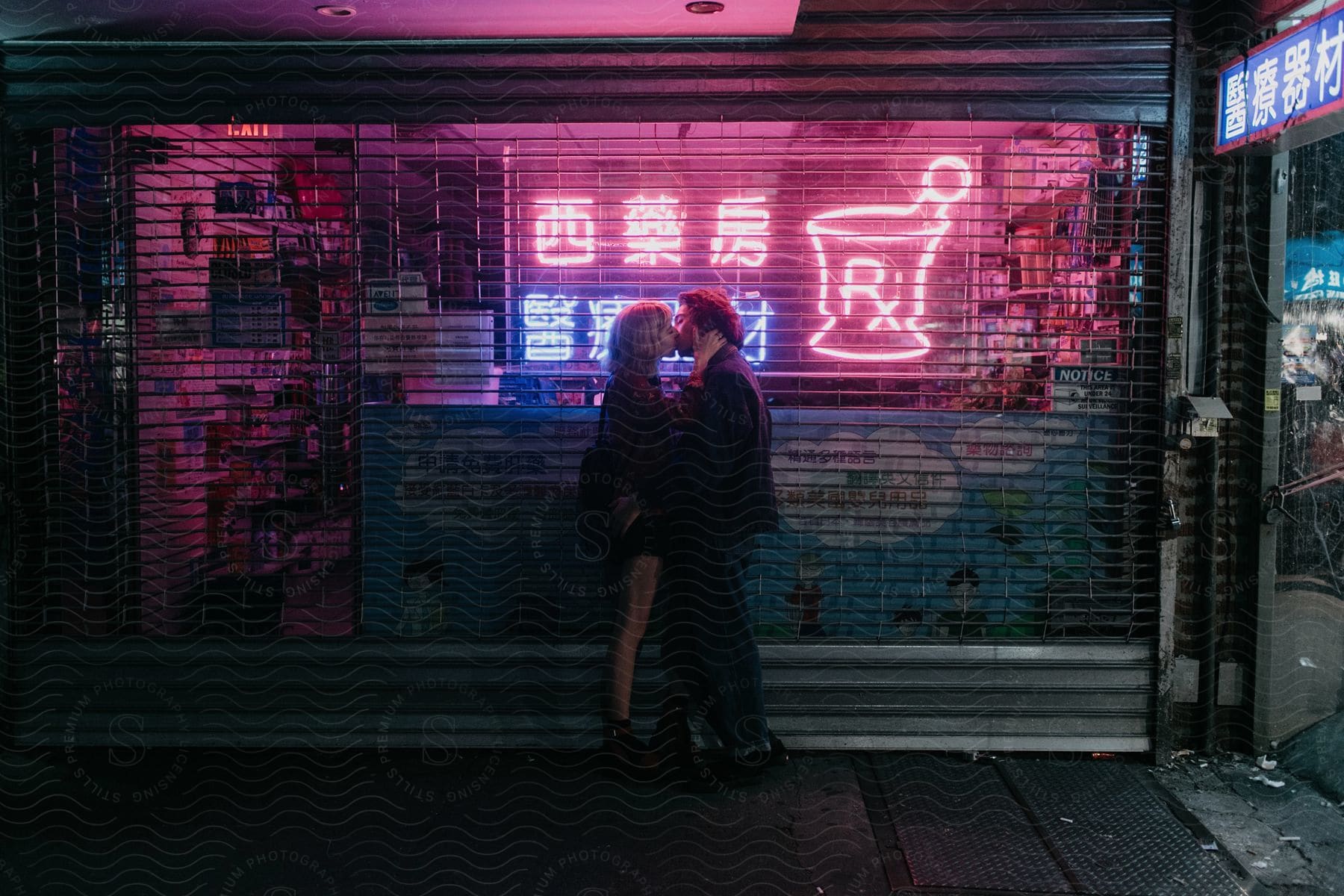 Two happy people in an urban city at night