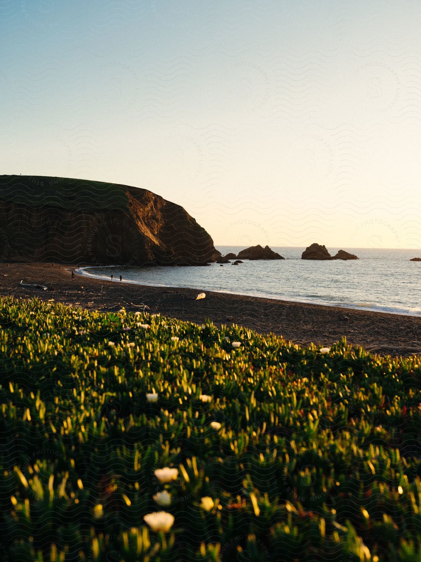 The sun is setting above the ocean water