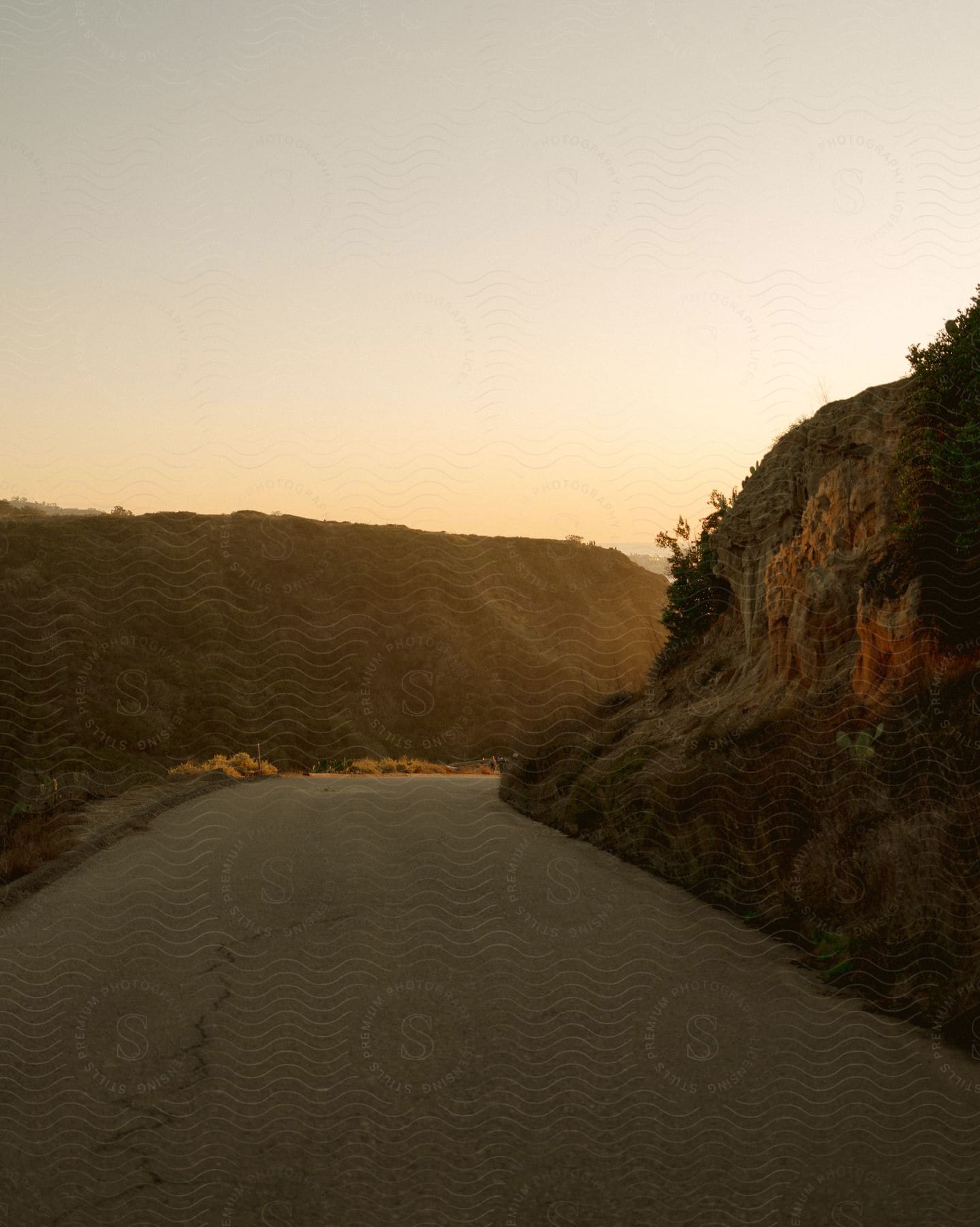 A curved road surrounded by hills