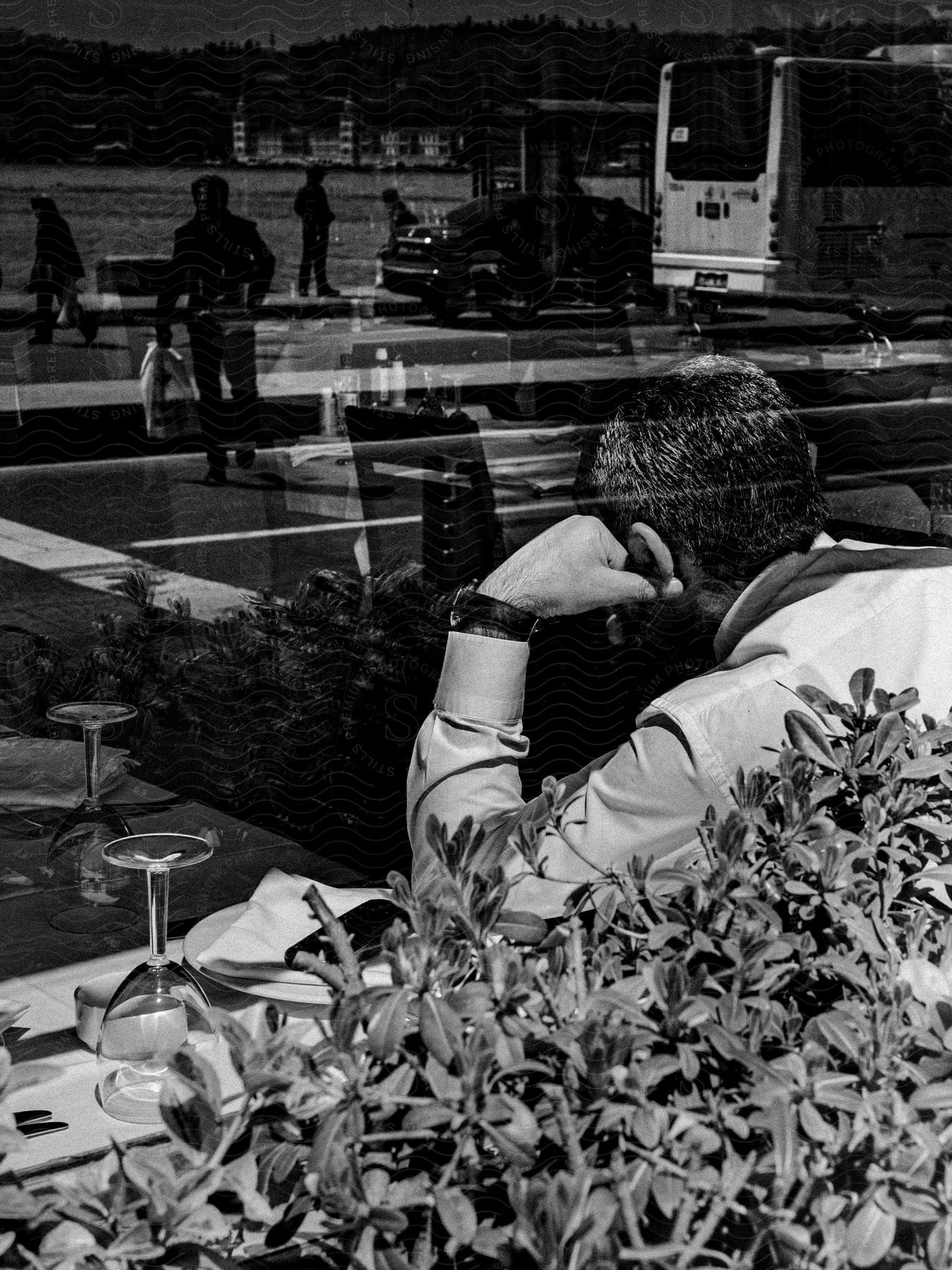 A man sitting in a restaurant deep in thought