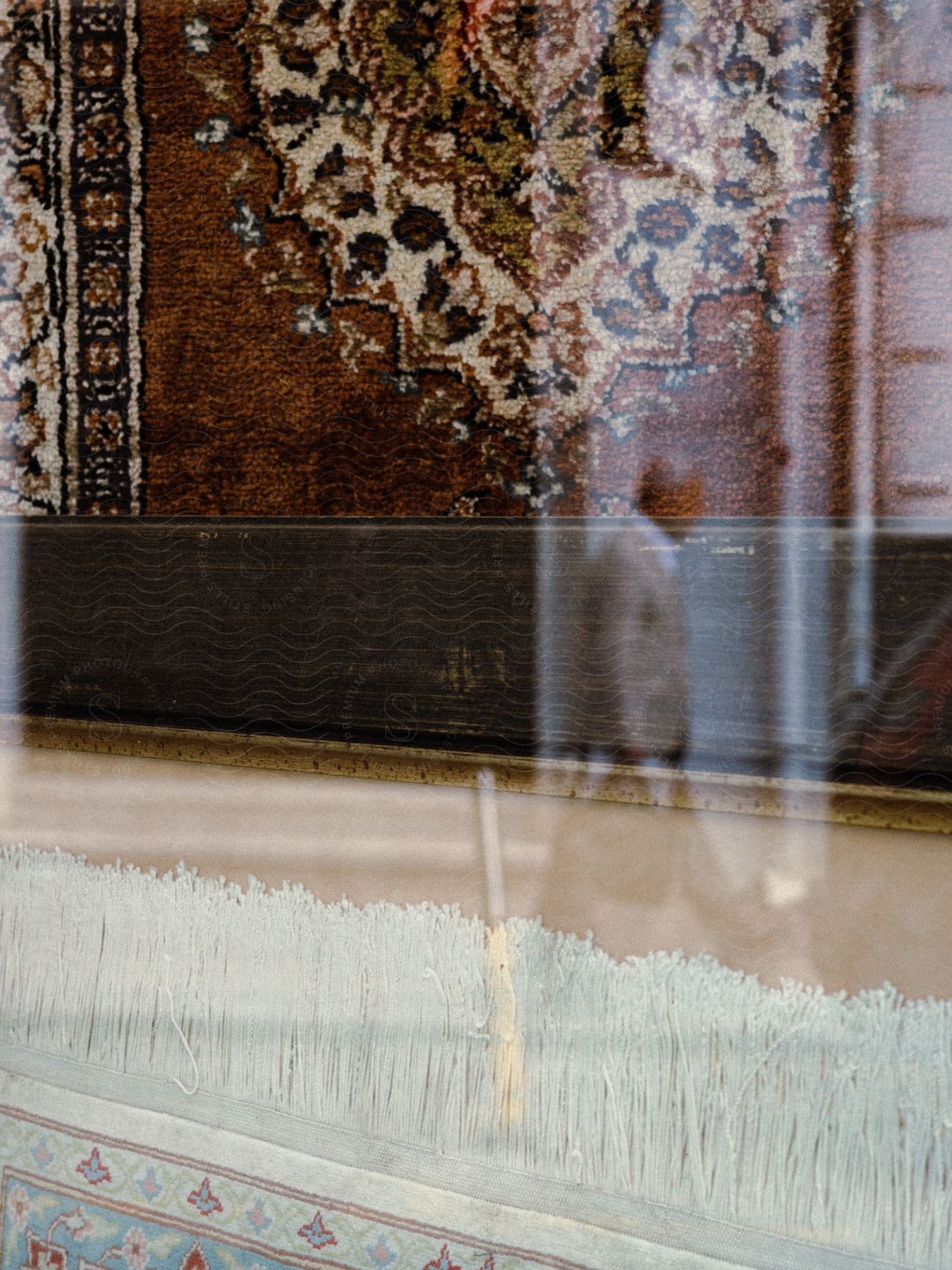 Walking business man reflected in glasscovered wallmounted carpet