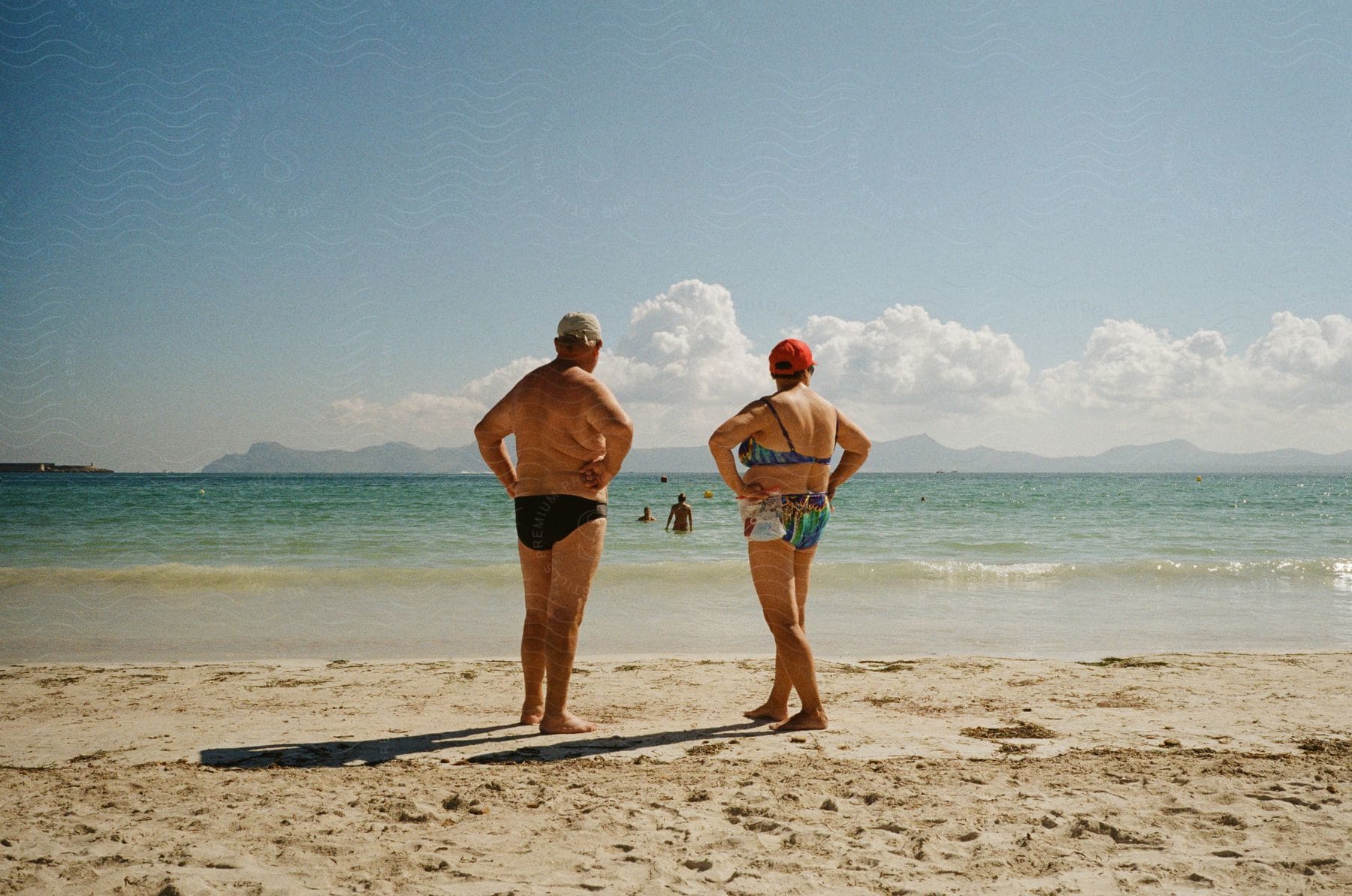 People hanging out on the beach coast on a sunny day