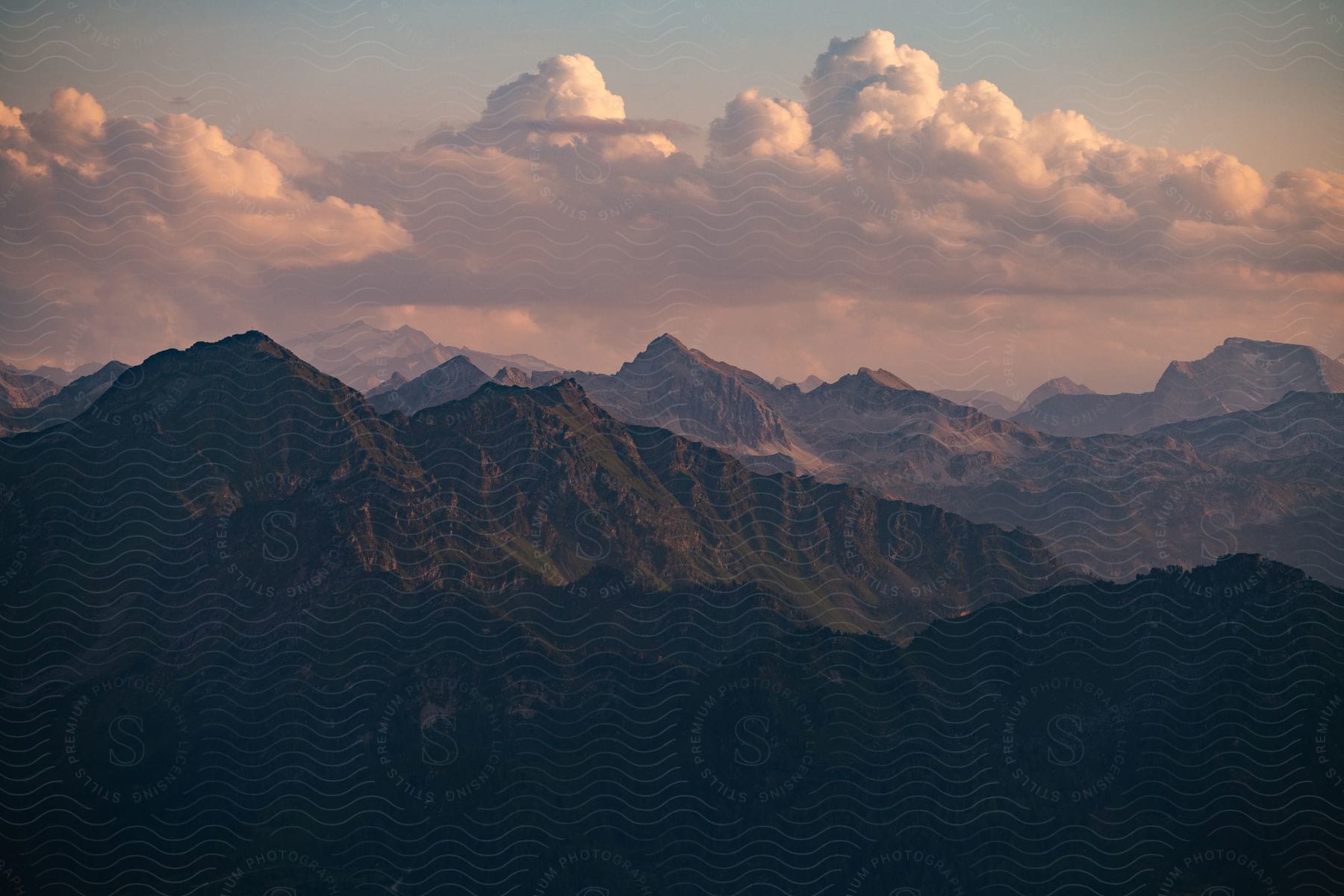 Mountains stretch across the landscape under a cloudy sky