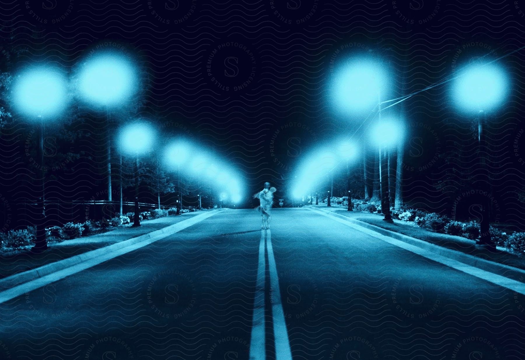 A person on a road at night