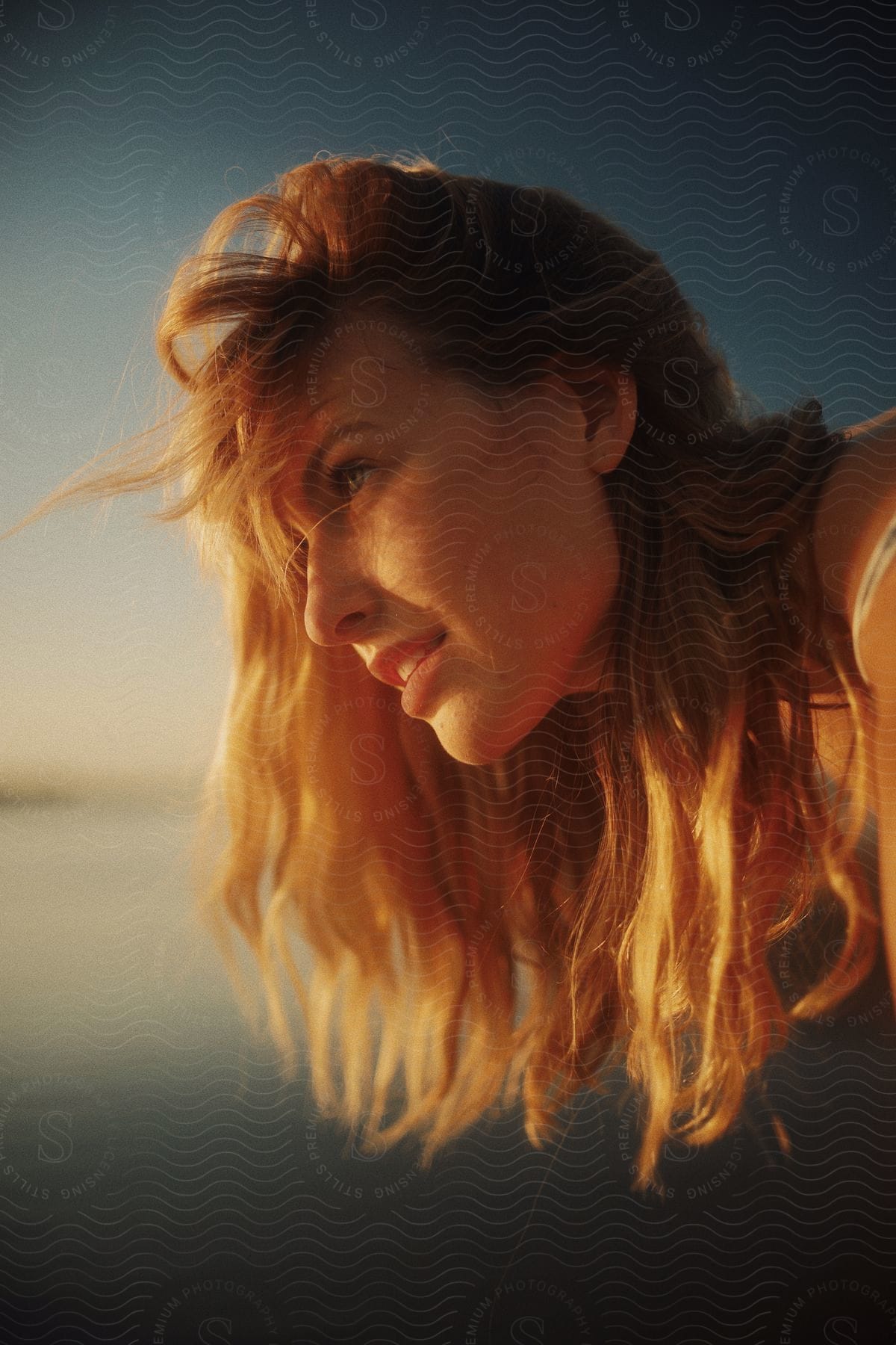 A woman standing outdoors smiling