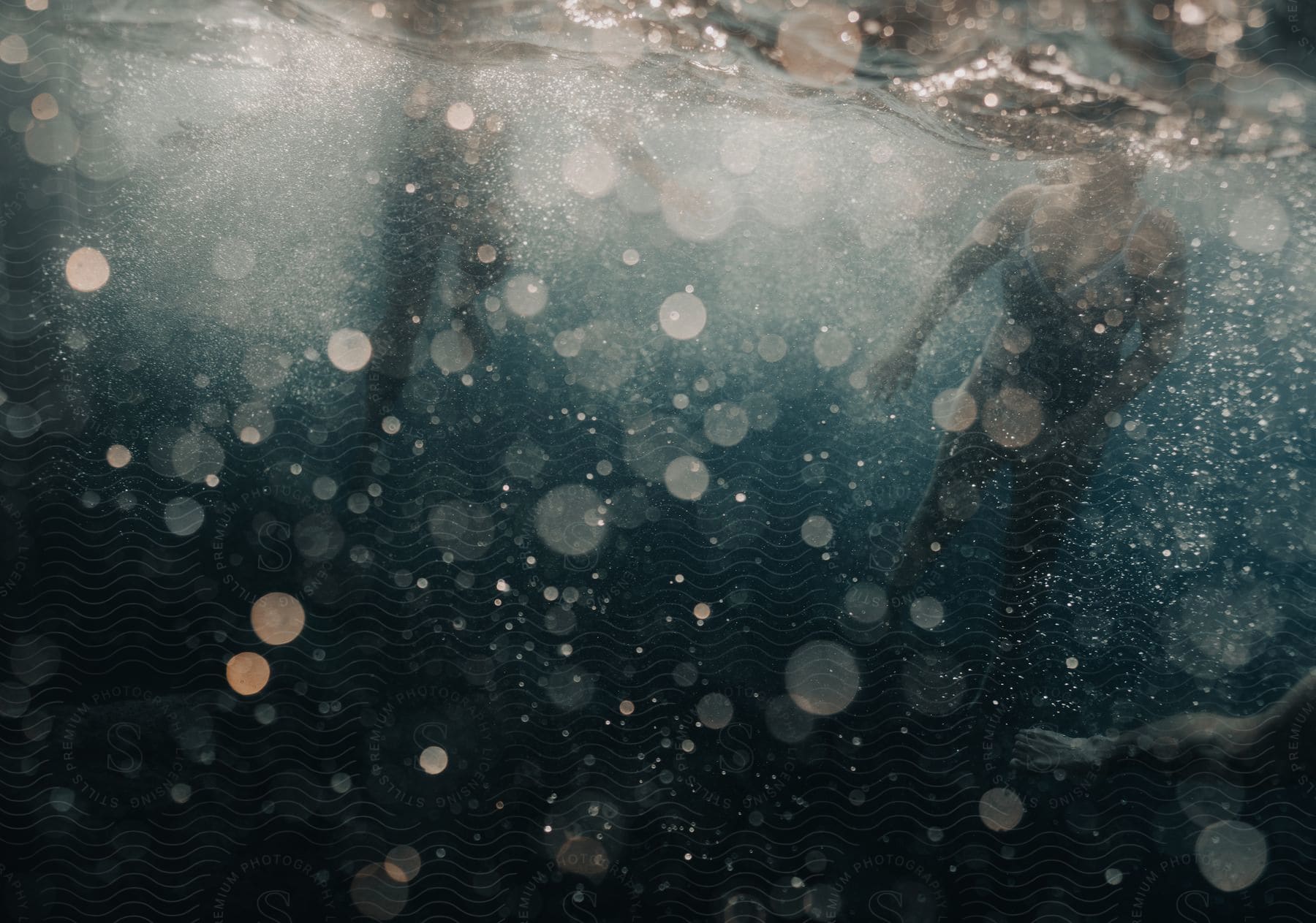 A womans body is reflected on water