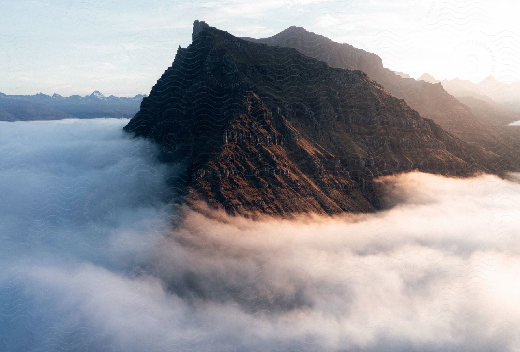 Clouds covering mountainous landscape in iceland