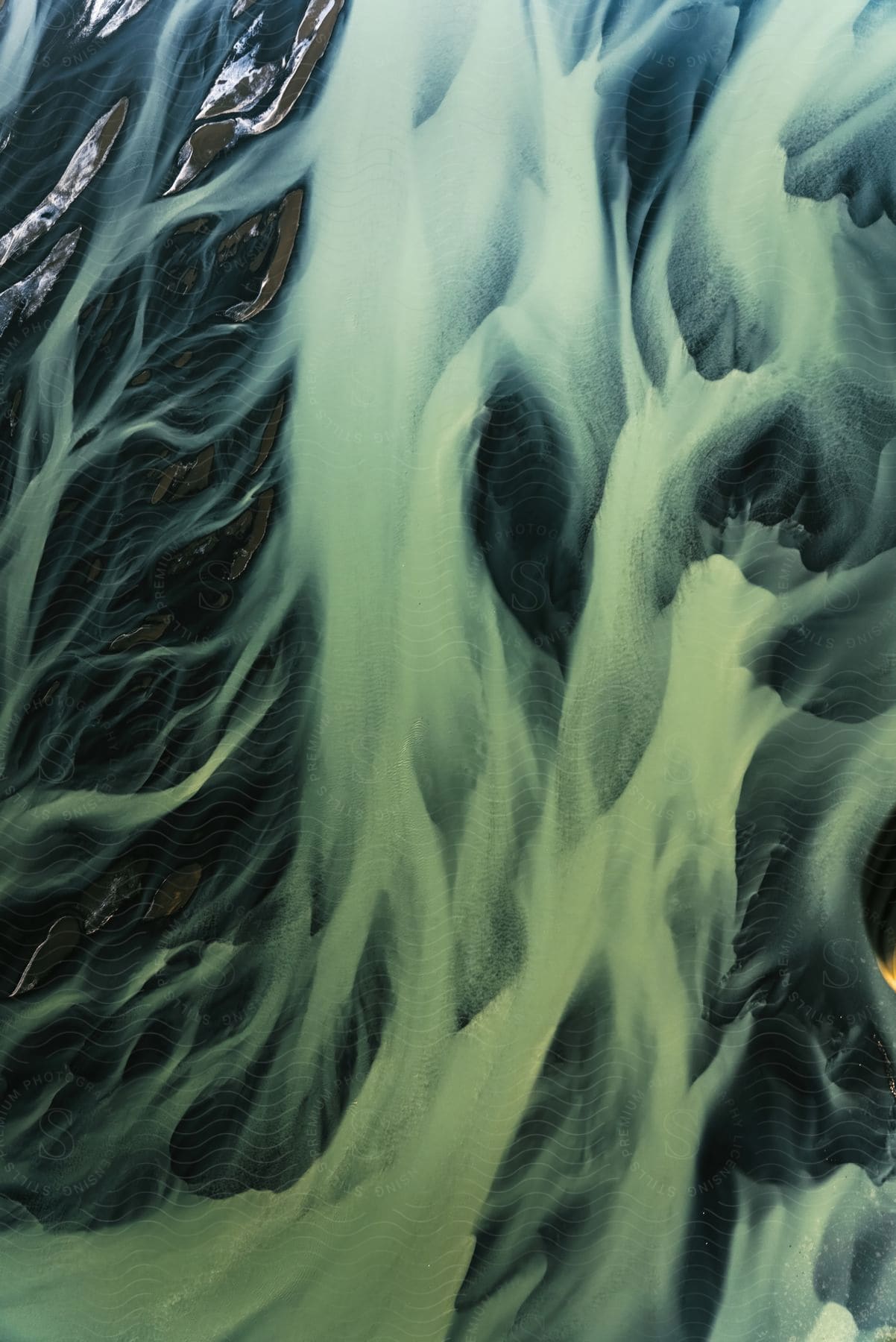 Close up of abstract green liquid flowing in glacial river iceland