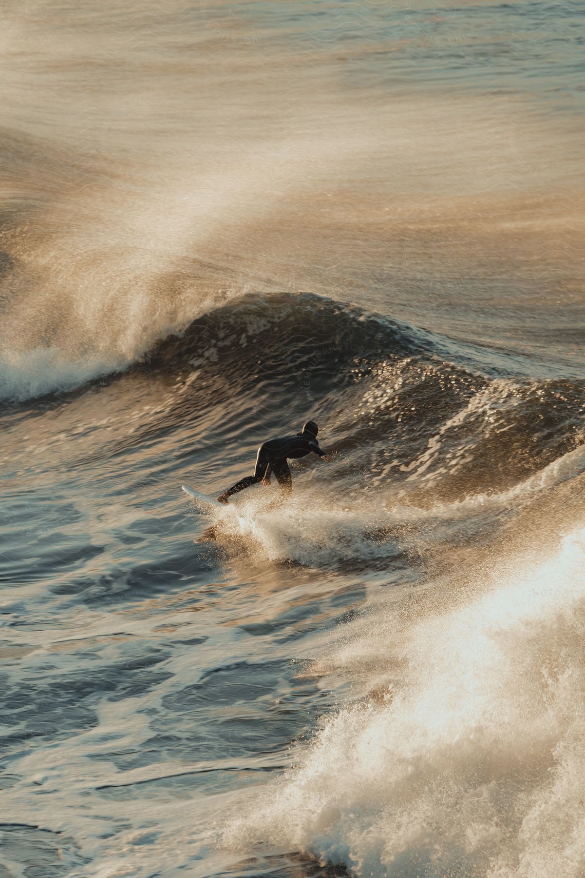 A surfer riding an ocean wave in california