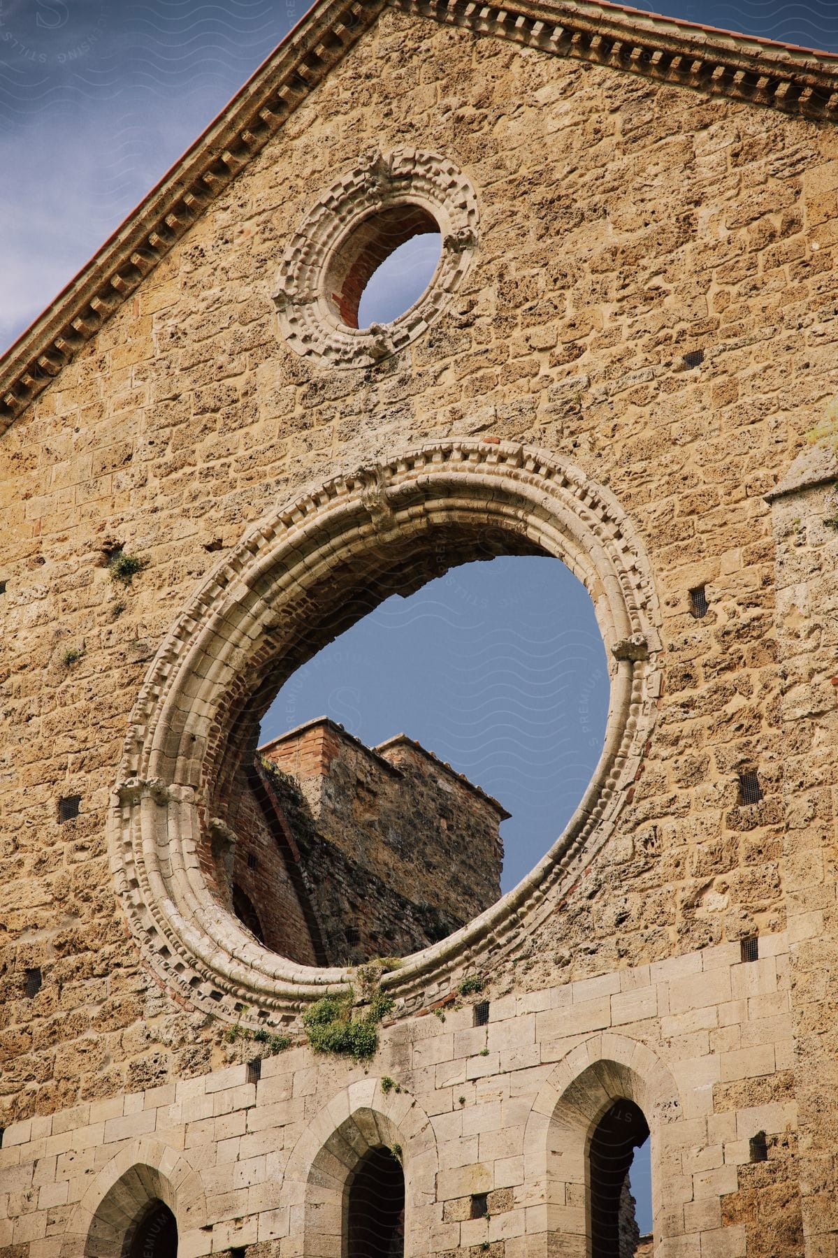 An old brick building with circular openings