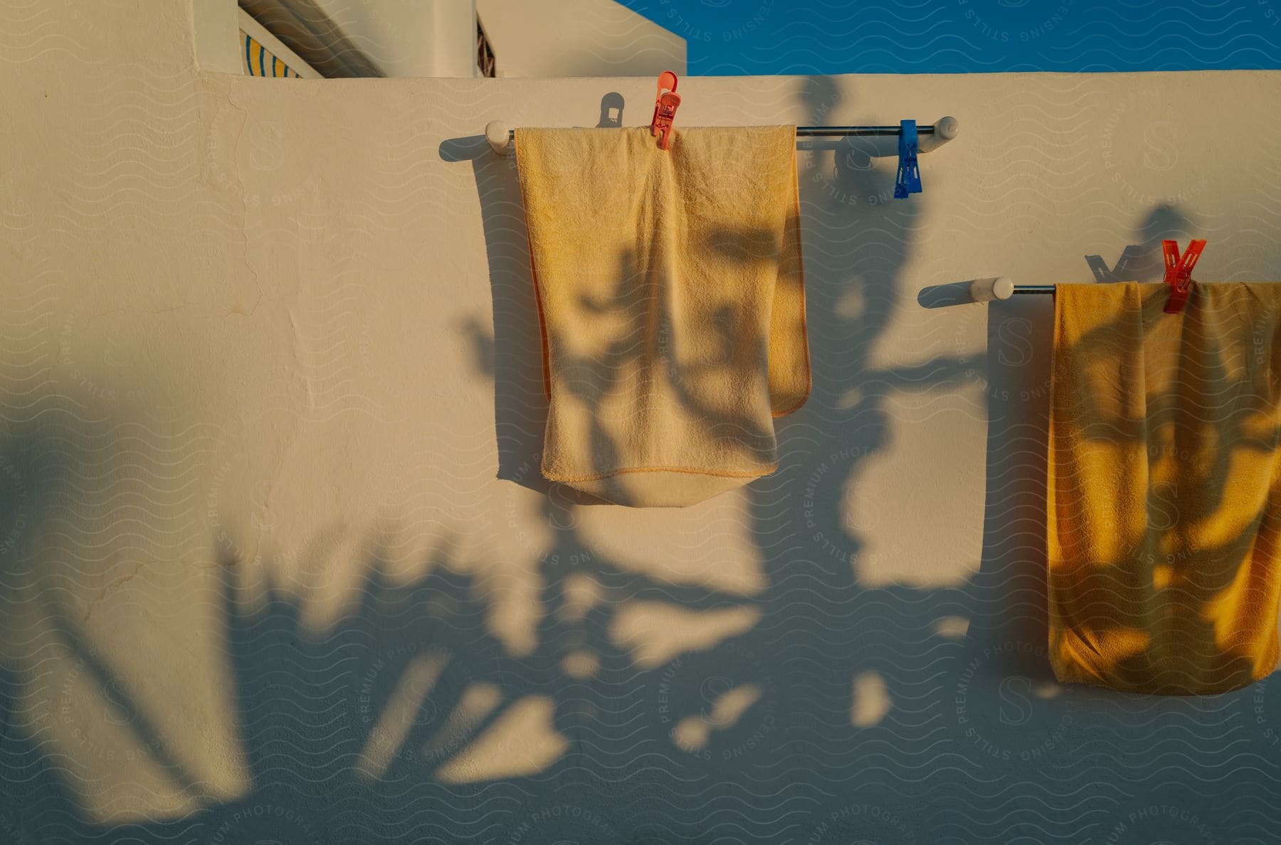 Towels hand on racks outside a building