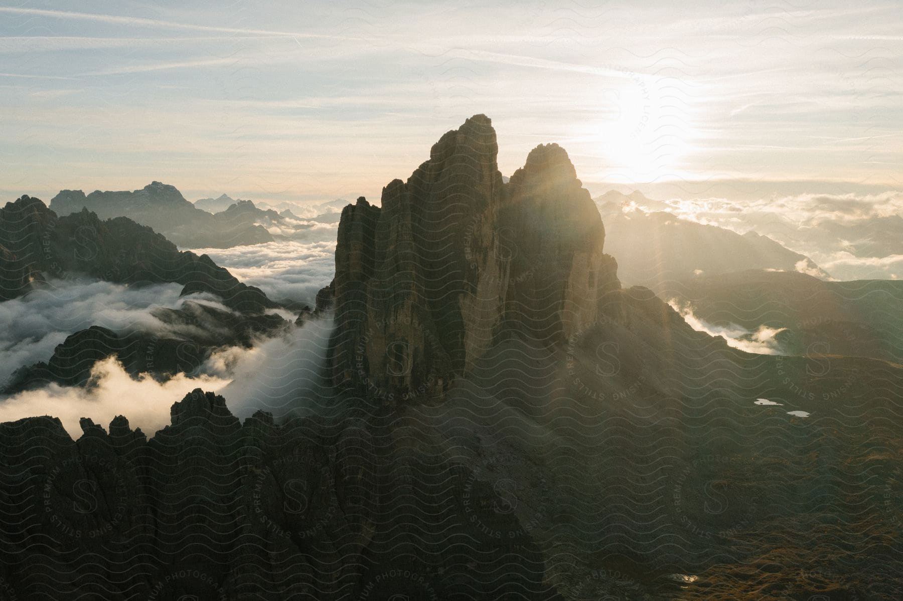 A misty mountain surrounded by clouds and rocks