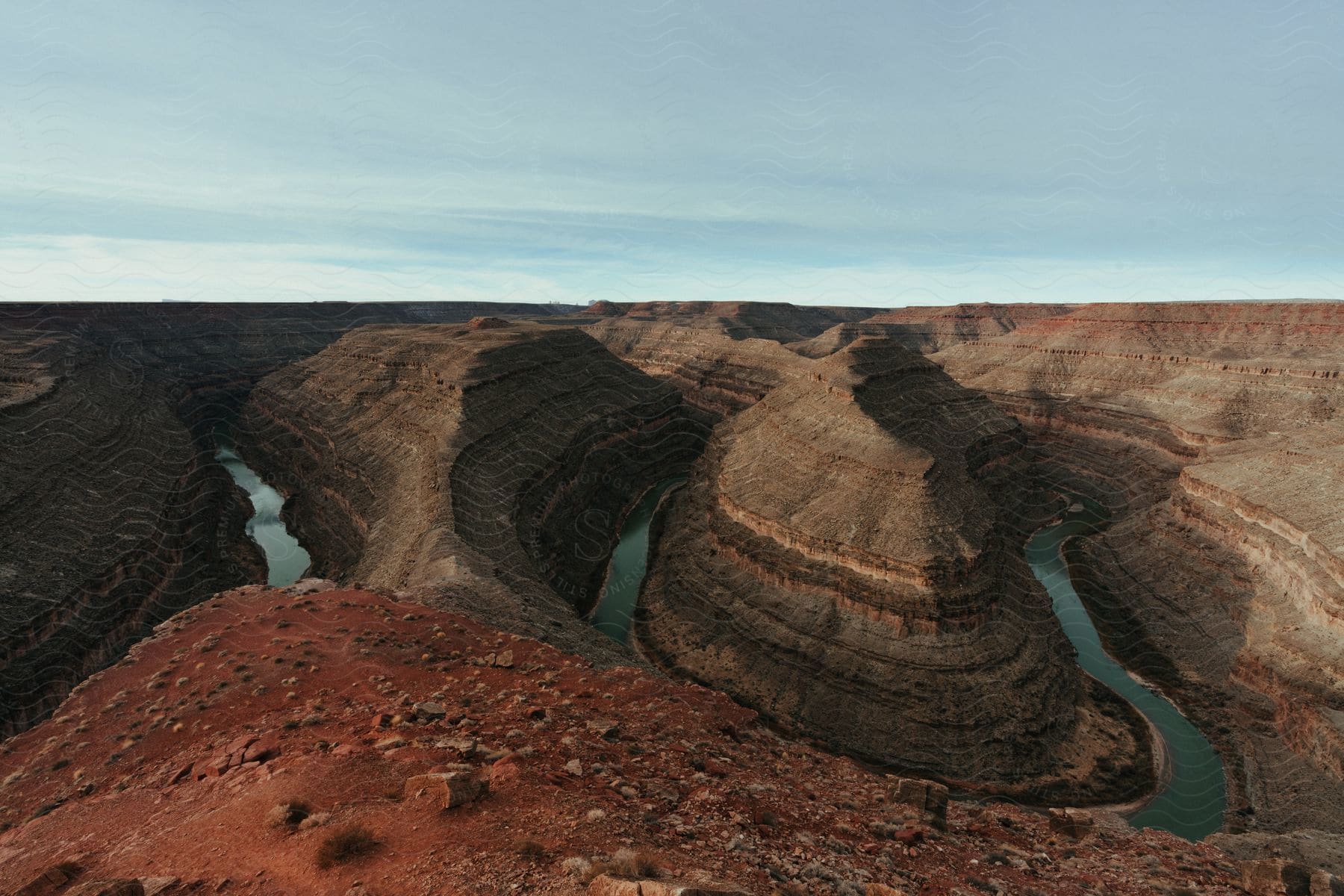 Canyon surrounded by serene lake and rugged cliffs