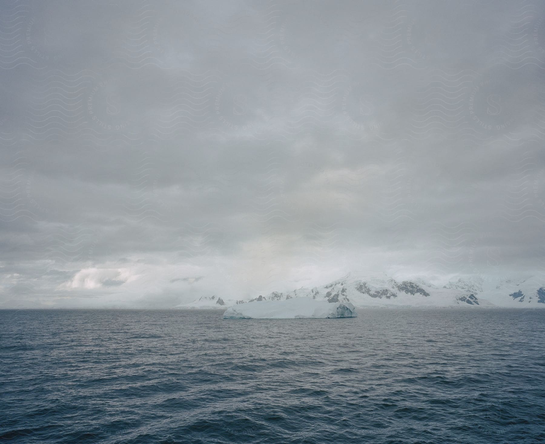 Landscape of foggy body of water ice cap and coastline