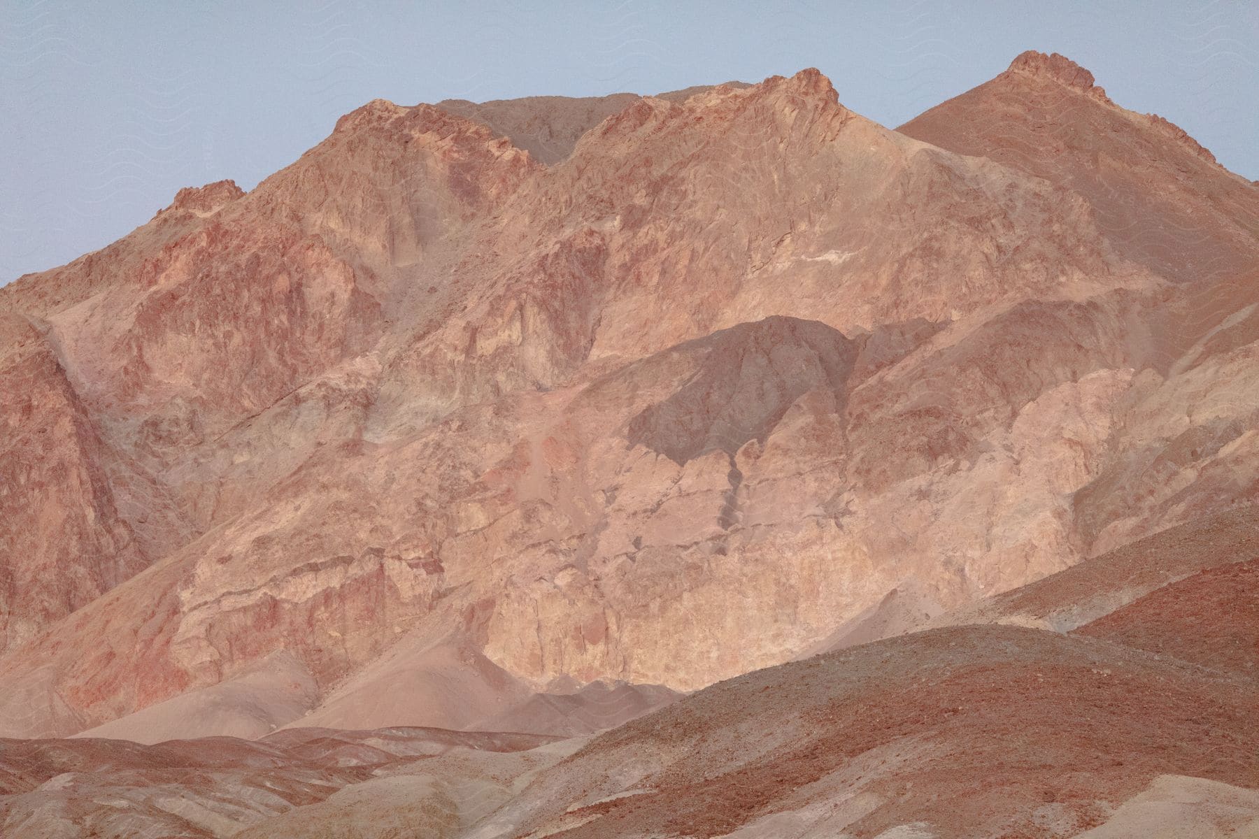 Brown rugged mountain range in an outdoor desert landscape