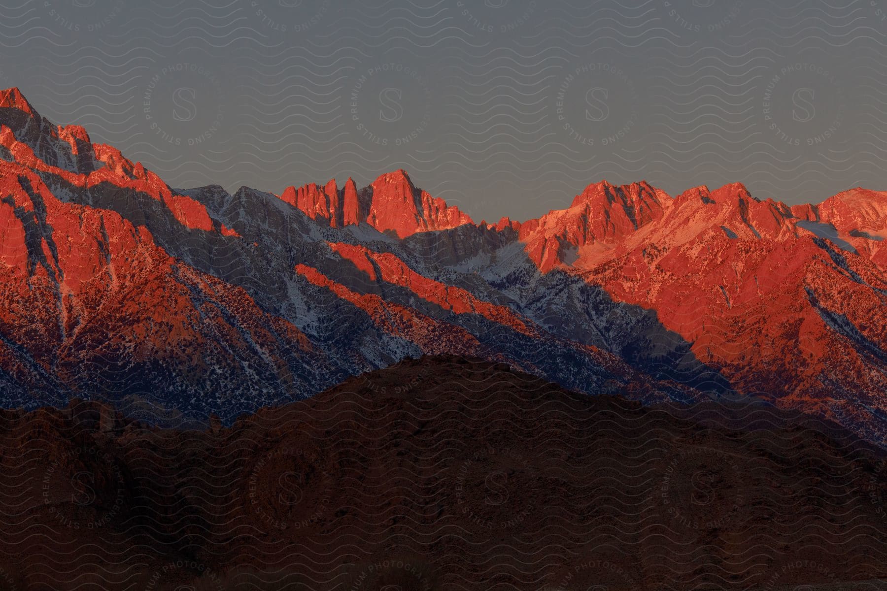 Redlit mountains at dusk in an american desert landscape