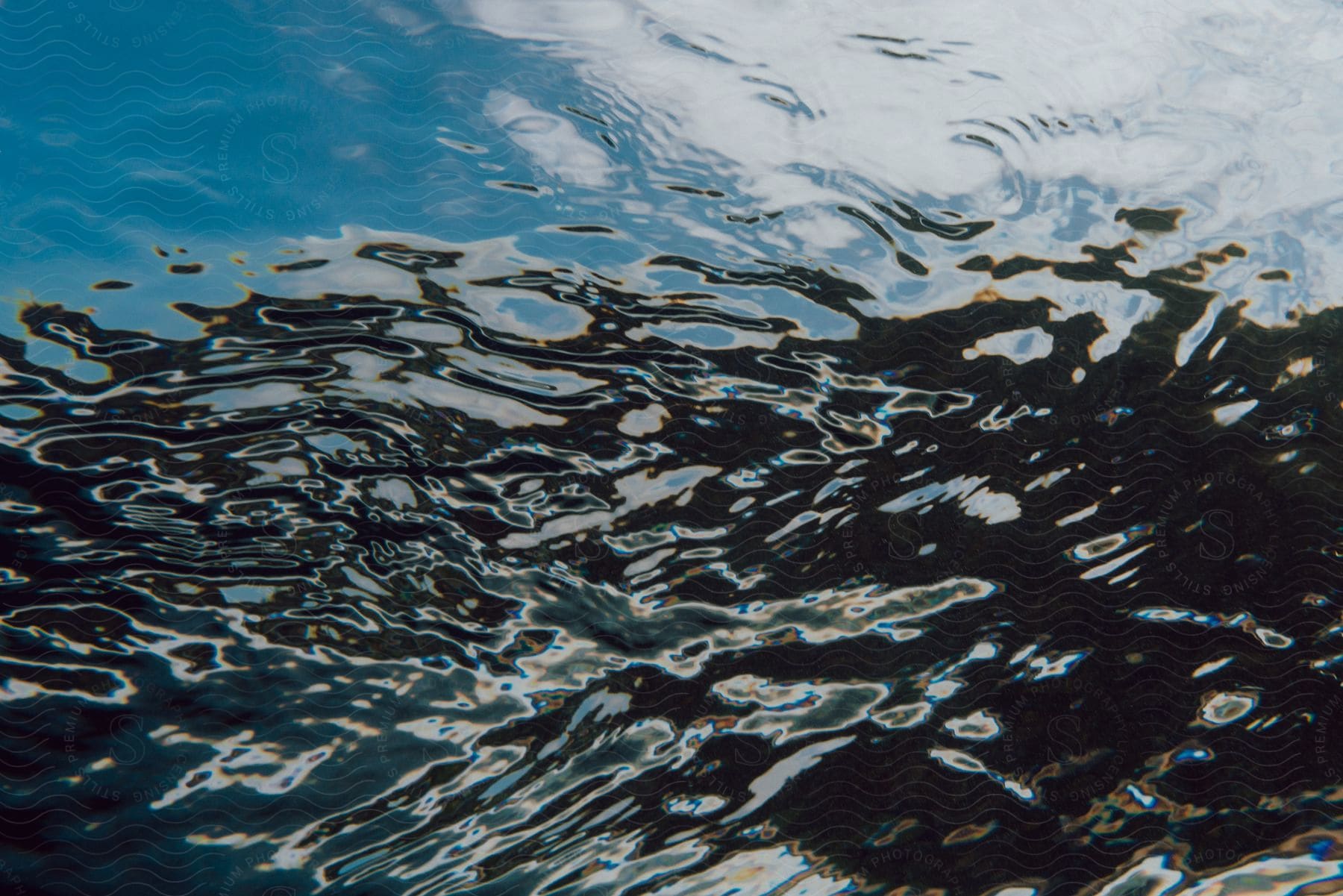 Little ripples in a close up of a lake