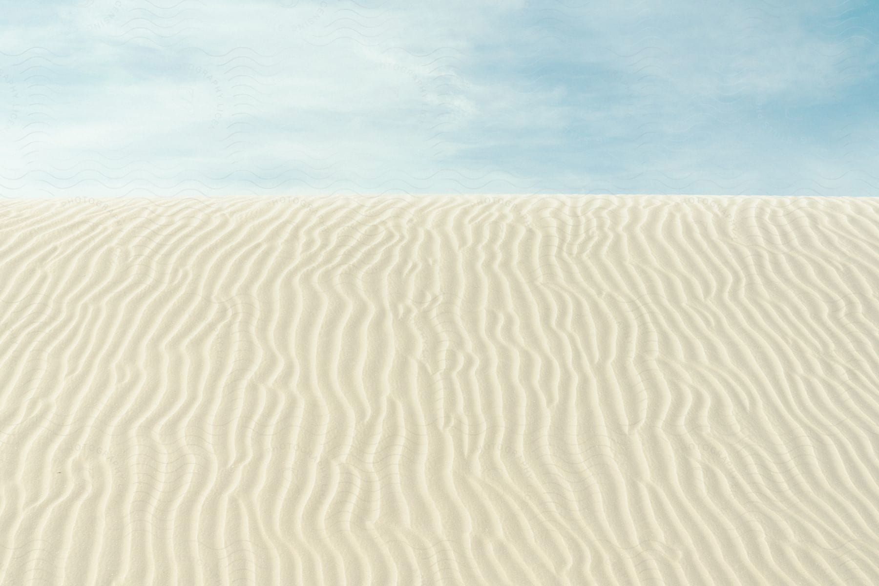 Flat landscape with white sand in a desert setting